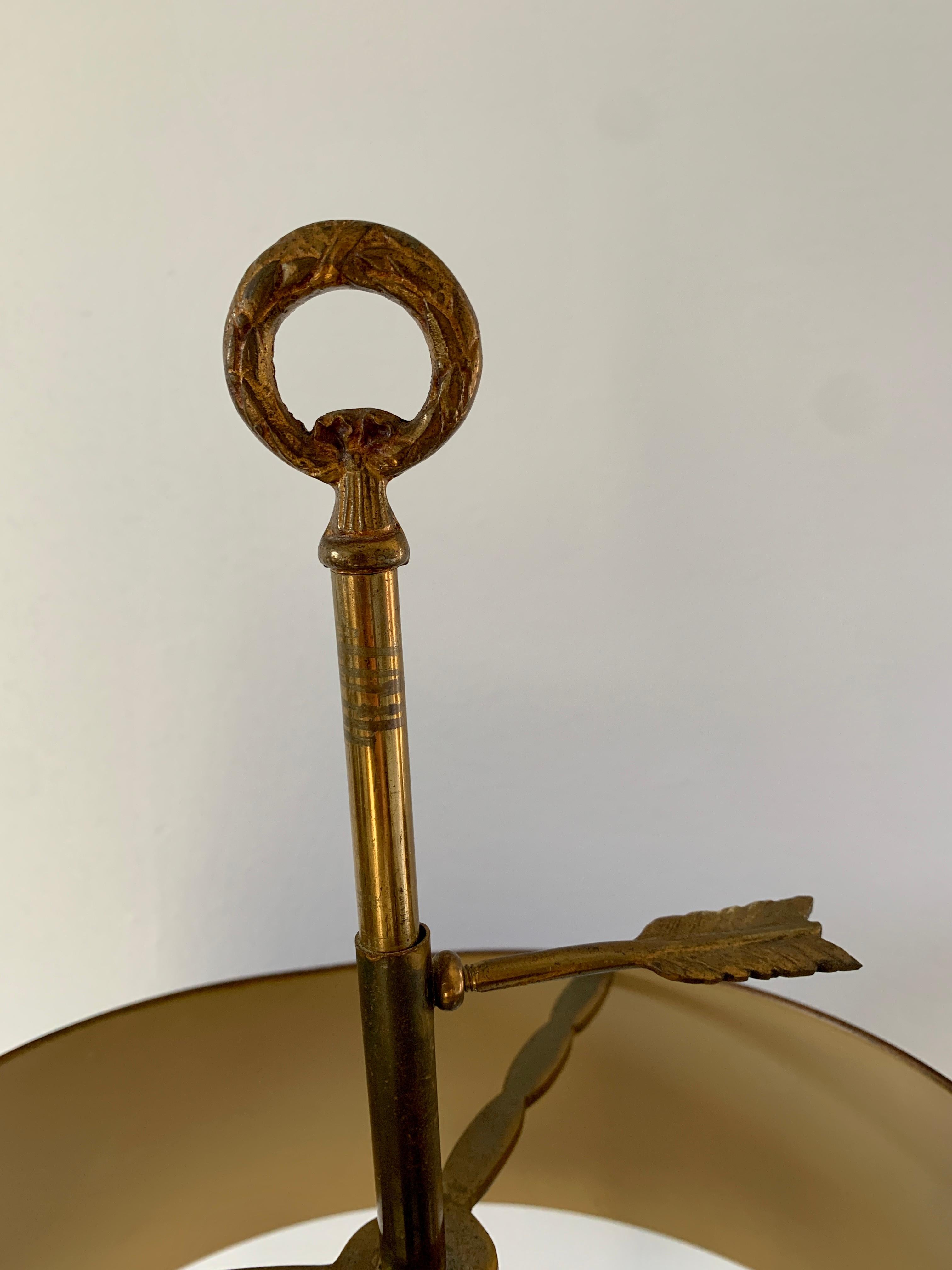 A gorgeous brass three-arm horn bouillotte lamp with red & gold tole shade

USA, Mid-20th Century

Measures: 13