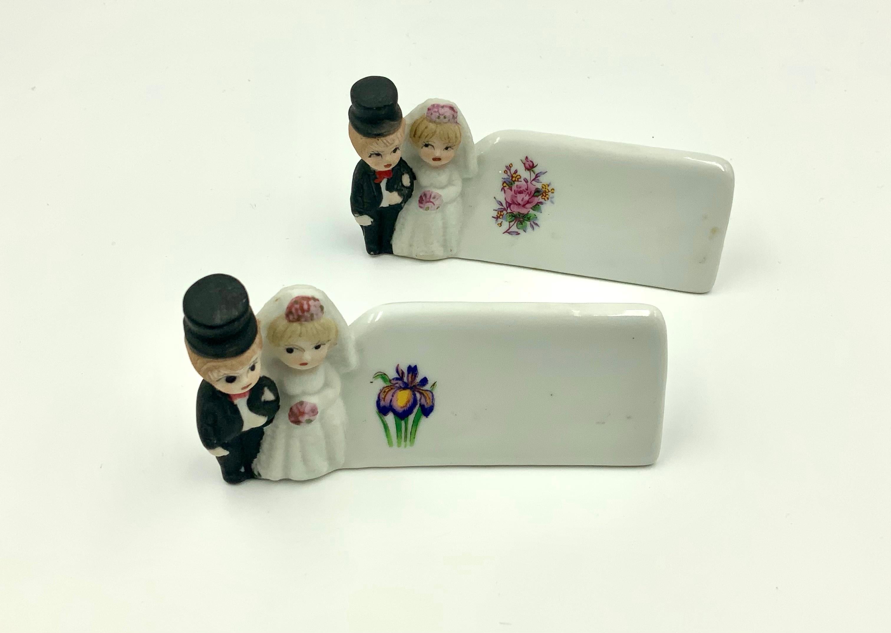 Hard to find adorable hand-painted bride and groom place card holders with flower decals. I have 3 sets of 2 available. Each pair has a different flower on the name area. This set has a crack on the bottom so it is listed separately at a lower price.