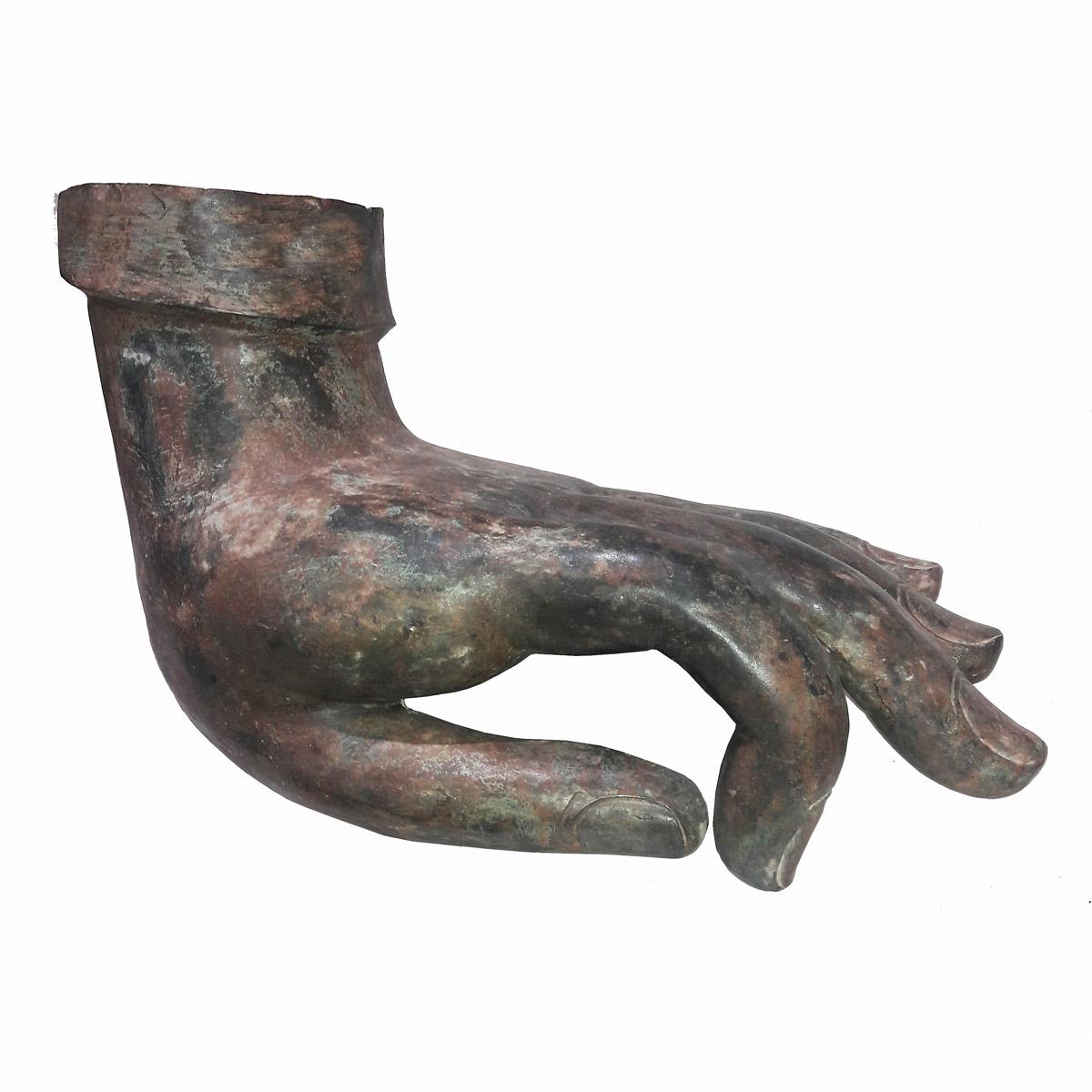 A bronze Buddha hand floor / table sculpture in Dharmchakra Mudra, the traditional gesture of teaching. 
Cast bronze with a natural green patina.