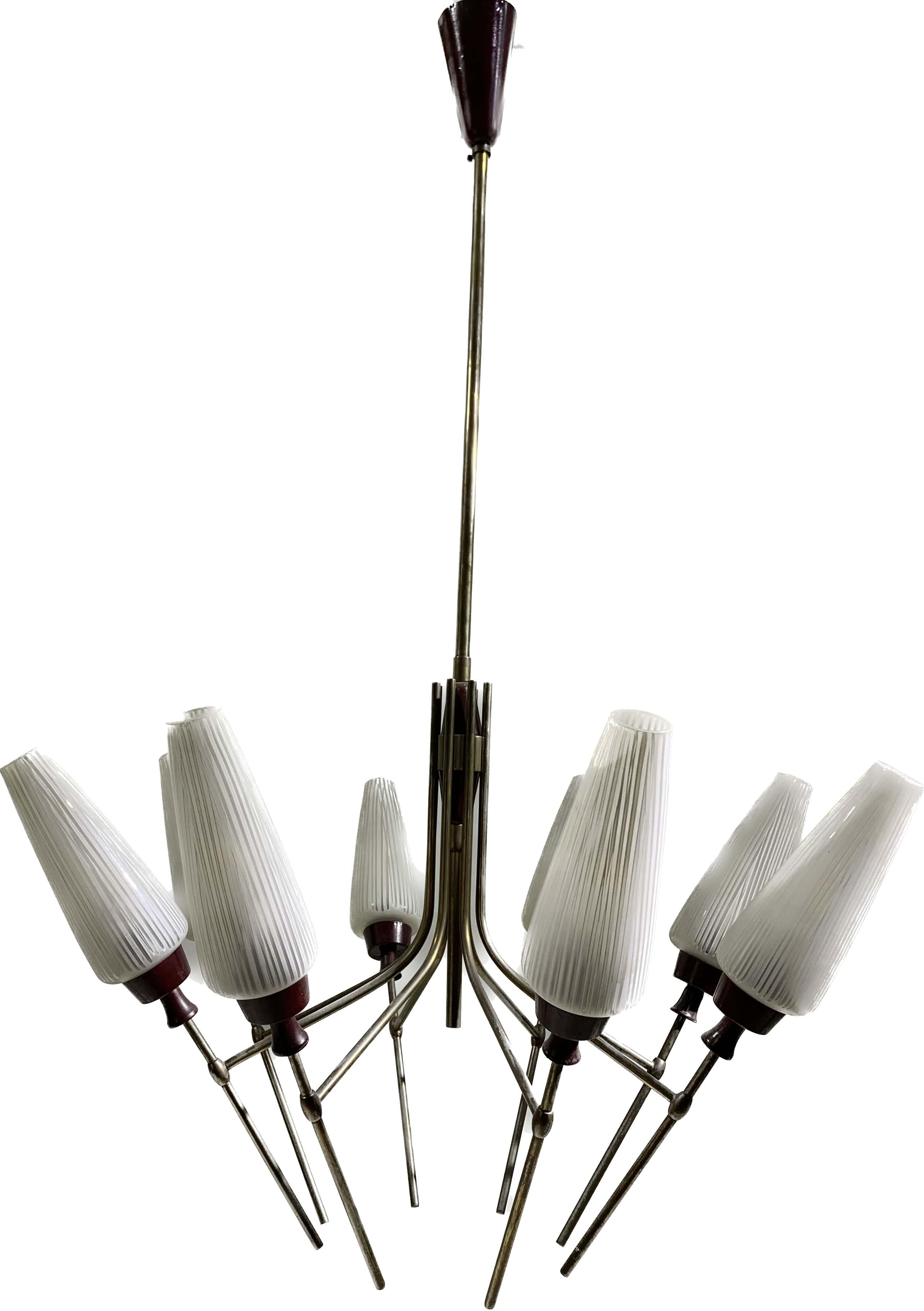 Midcentury chandelier made of bronze structure with eight « tulip » glass branches that have been sanded and striped. They each have an enamelled metal lampholding cup of the bordeaux colour, an intense and dark red visual.
This beautiful pending