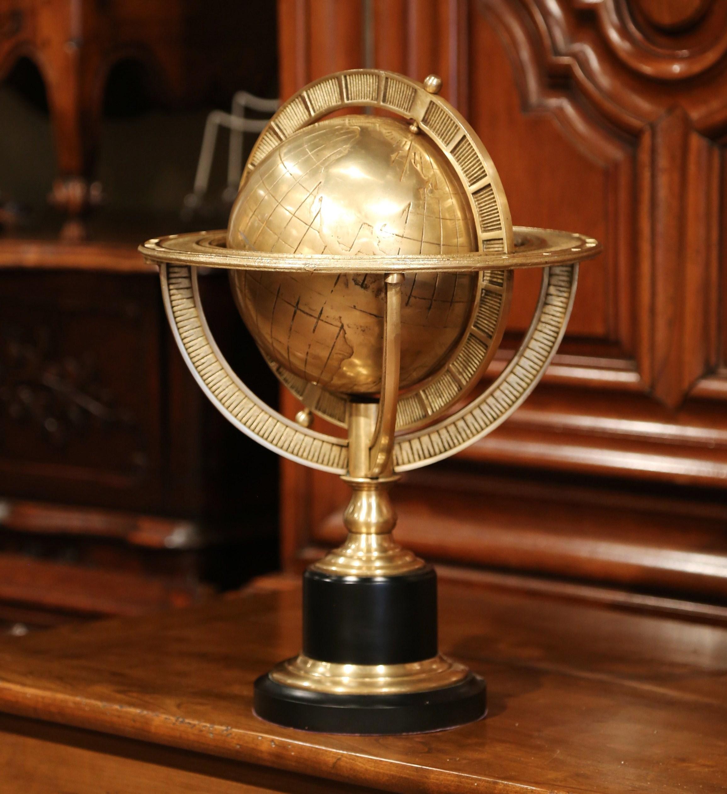 Decorate your office or study with this vintage, bronze globe. Crafted in France, circa 1960, the bronze globe has a gridded map, a rotating motion and sits on a black painted wood base. This globe is a must-have for the world traveler interested in