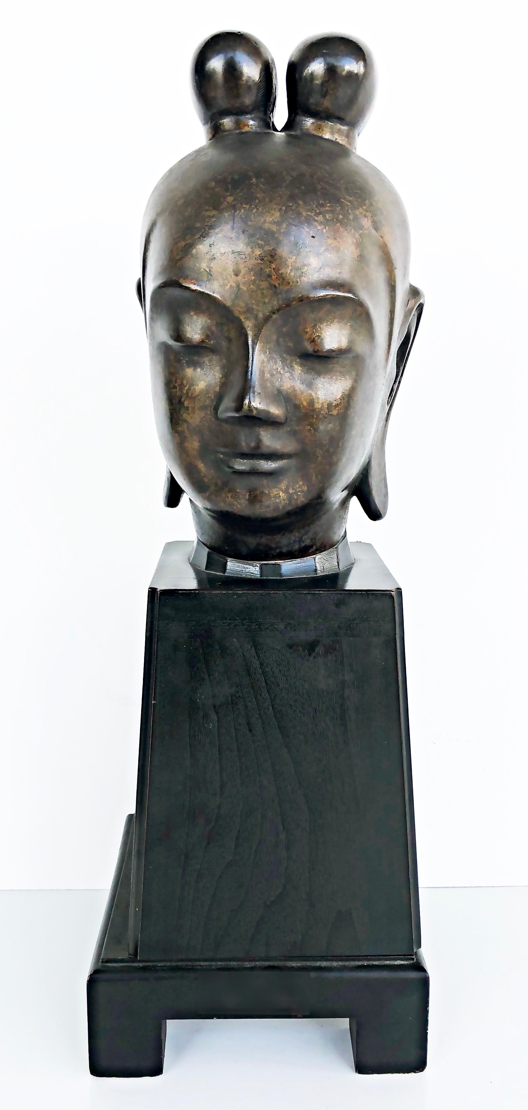 Mid-20th century Bronze Japanese Buddha Sculpture on Plinth

Offered for sale is a bronze early to mid 20th century Japanese figurative sculpture of a Buddha raised on a plinth. The base is offset from the bust.