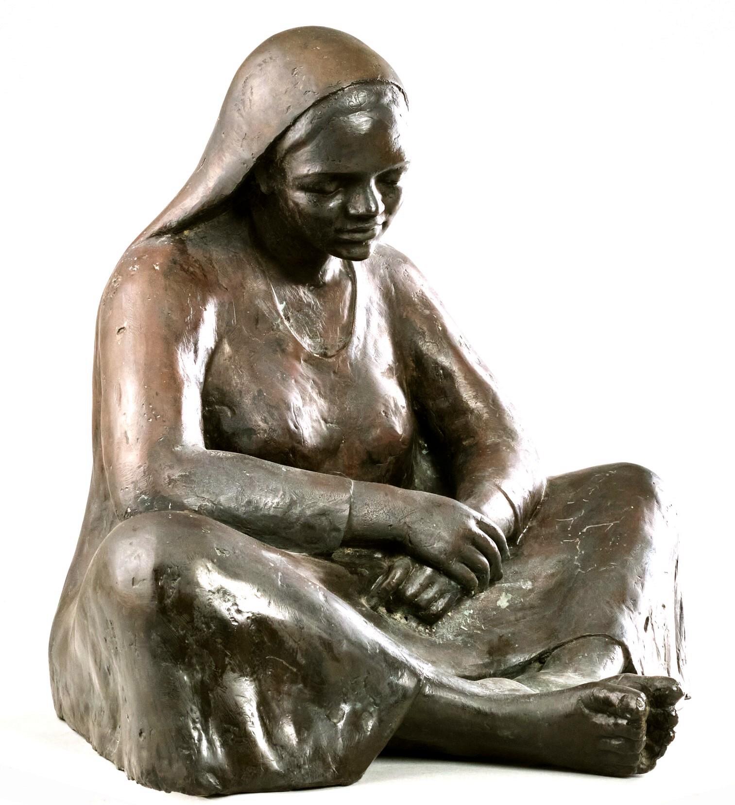 This large and impressive cast bronze figure of a seated woman in a shawI, showing expertly rendered features & exacting proportions, and exhibiting a medium /dark brown patina overall. 
Although apparently unsigned, both the subject matter and the