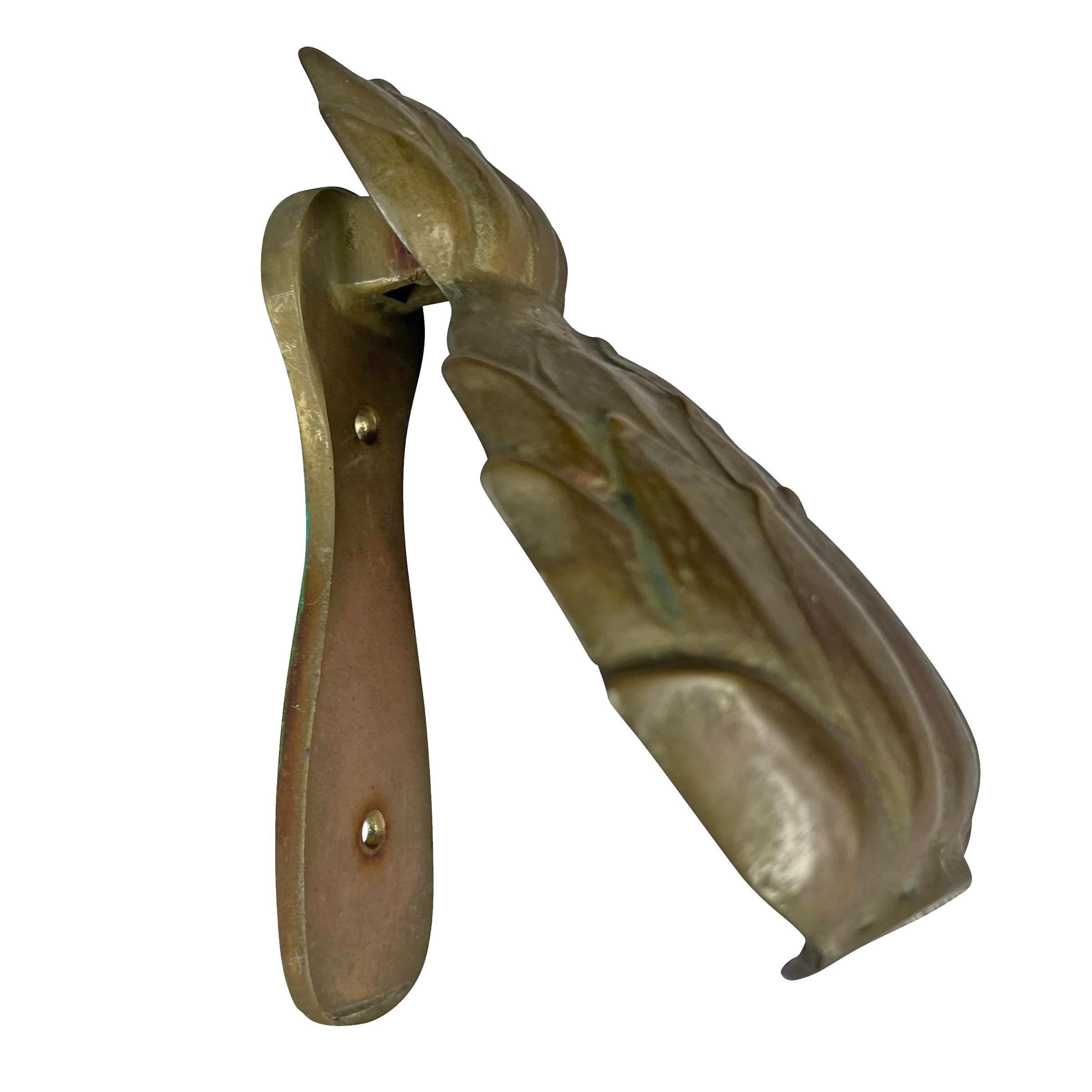 heurtoir de porte main signification