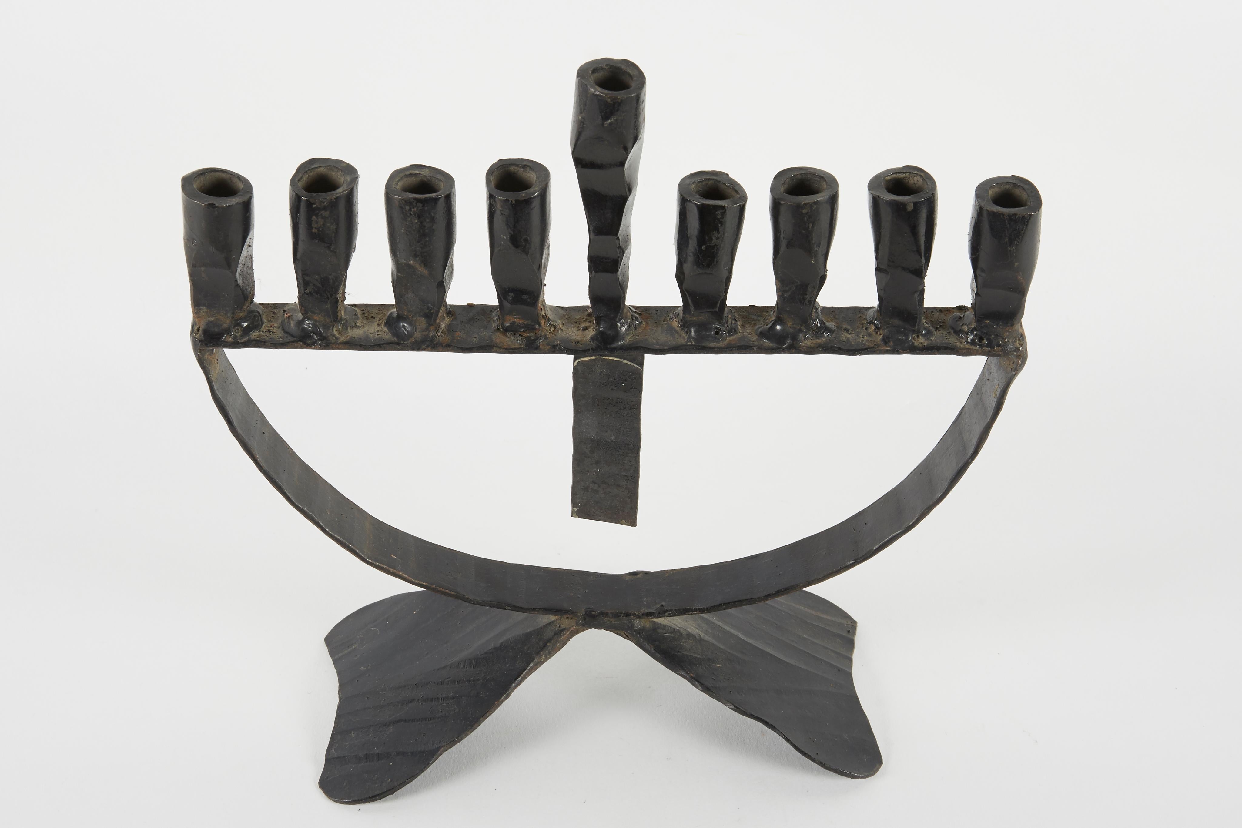 Hand forged, iron Hanukkah lamp Menorah in the style known as “Brutalism”, David Palombo, Jerusalem, Israel, circa 1950.

David Palombo (1920-1966), was a sculptor and painter. He was born in Turkey and immigrated to Israel with his parents in 1923.