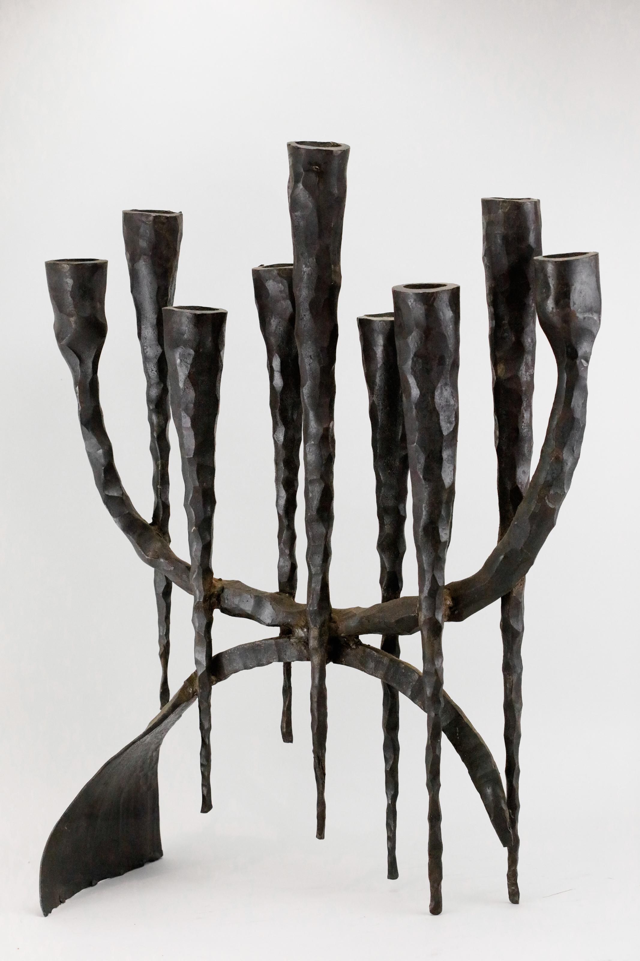Large, hand forged, iron Hanukkah lamp Menorah in the style known as “Brutalism”, David Palombo, Jerusalem, Israel, circa 1960.

David Palombo (1920-1966), was a sculptor and painter. He was born in Turkey and immigrated to Israel with his parents