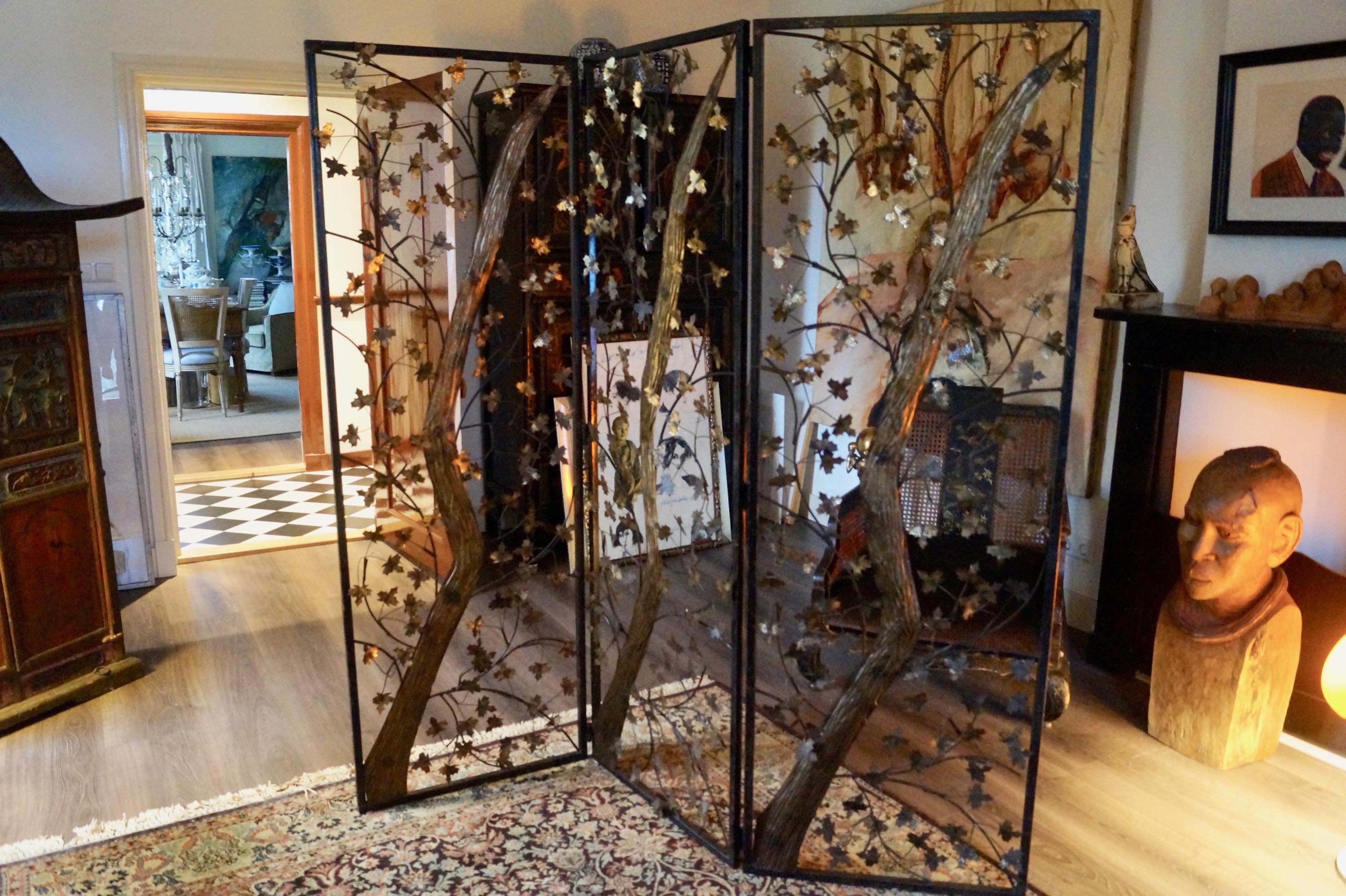 Mid-20th century Brutalist metal and brass leaves screen, England

Metal and brass rusty Brutalist screen. Metal with brass trunk and leaves.
Pictures are part of the description. 

Measures: H x W 176 cm x 180 cm.