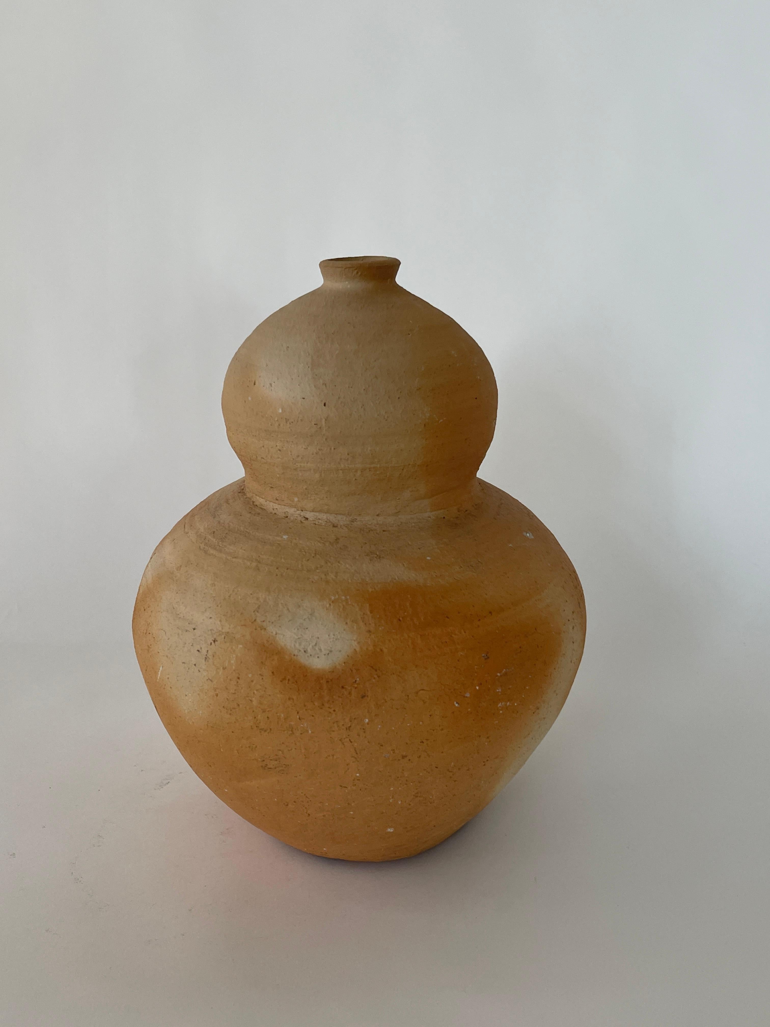 Mid 20th century Bubble Ceramic Vessel in a beautiful natural neutral colorway. Excellently hand crafted with rotational marks from the spinning technique.

Dimensions:
9