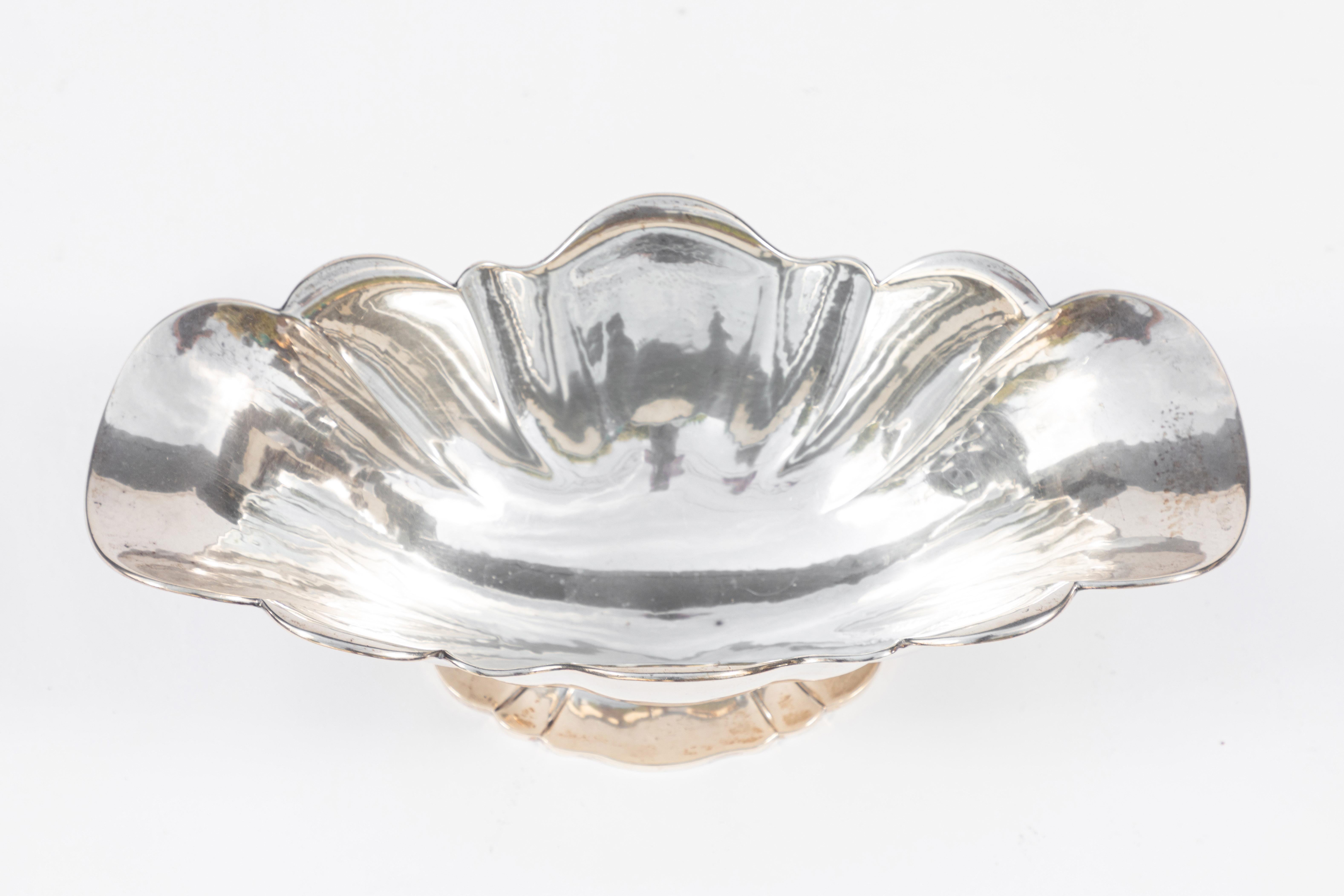 Mid-20th century Buccellati sterling silver scalloped center bowl signed and hallmarked.
44.64 oz.