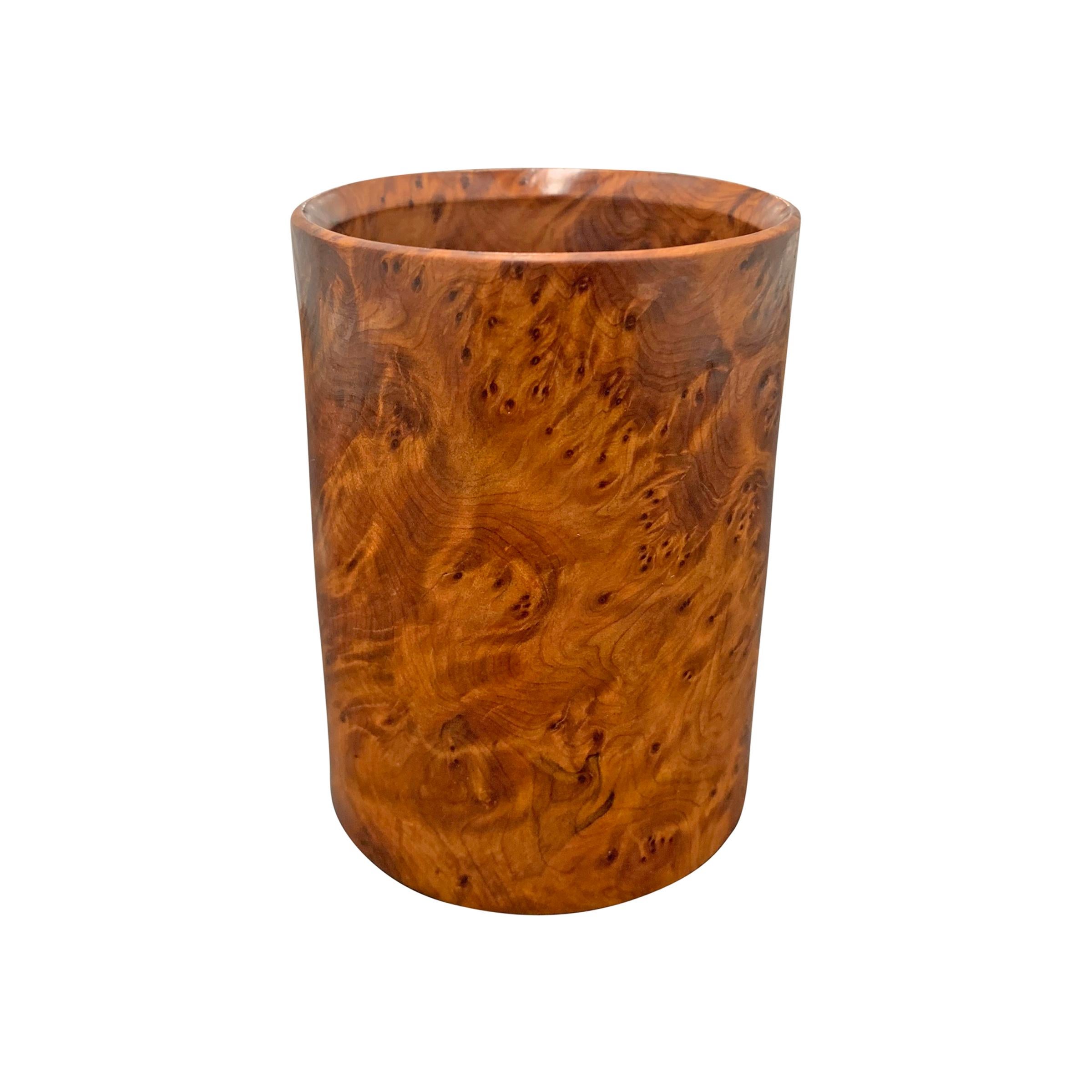 A wonderful mid-20th century burl wood pencil cup with a wildly expressive grain pattern that appears to glow from within!