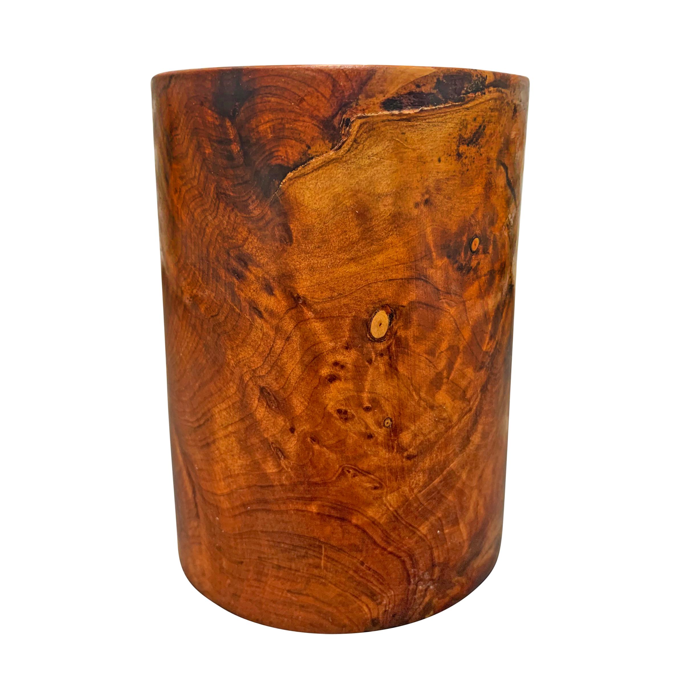 A wonderful mid-20th century burl wood pencil cup with a wildly expressive grain pattern that appears to glow from within!