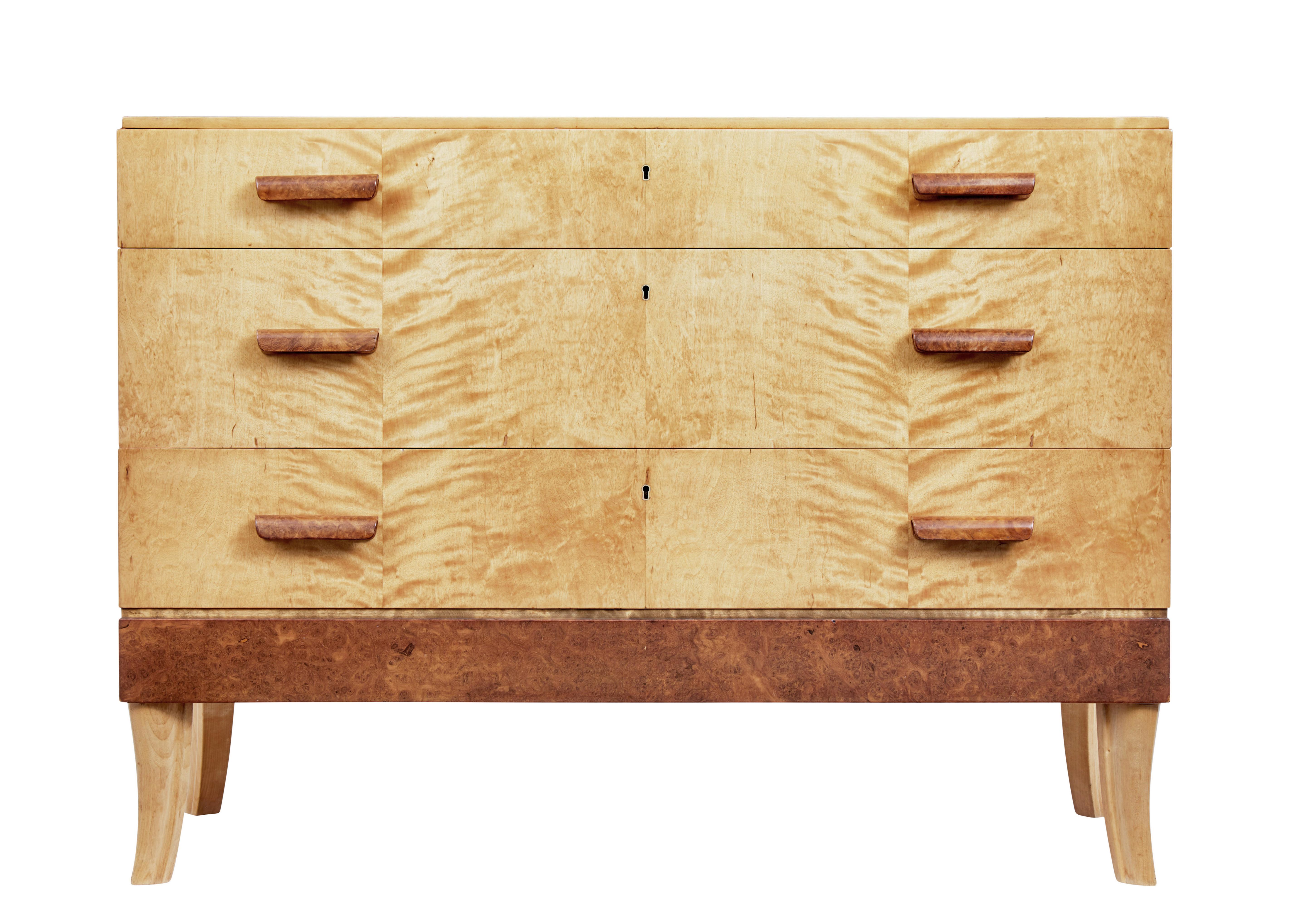 Mid 20th century burr birch Scandinavian chest of drawers circa 1950.

3 drawers fitted with burr shaped handles, top drawer fitted with partitions and fitted turned bowl for jewellery etc.

Handles and bottom burr panel add contrast to the