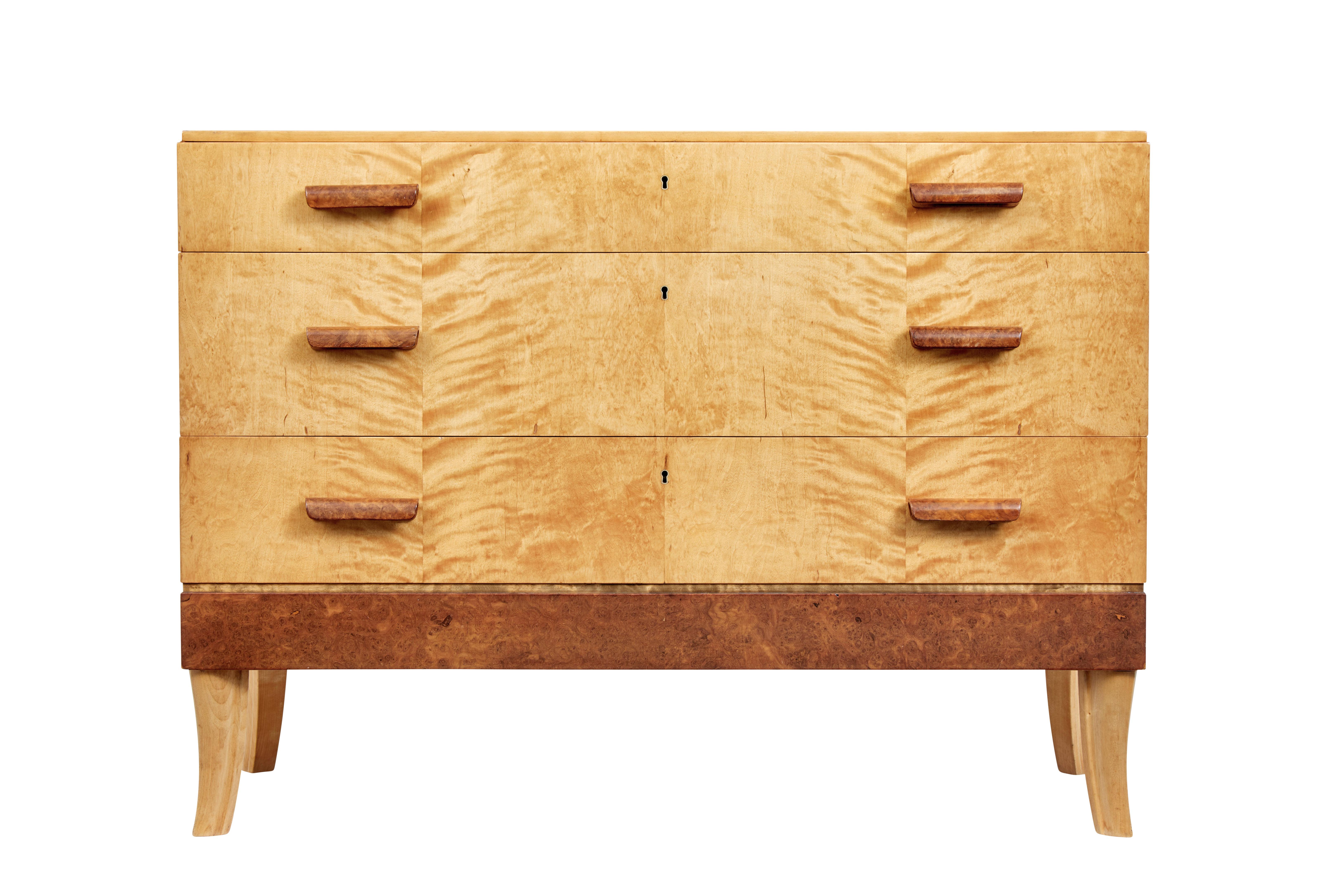 Mid-20th Century burr birch Scandinavian chest of drawers circa 1950.

3 drawers fitted with burr shaped handles, top drawer fitted with partitions and fitted turned bowl for jewellery etc.

Handles and bottom burr panel add contrast to the