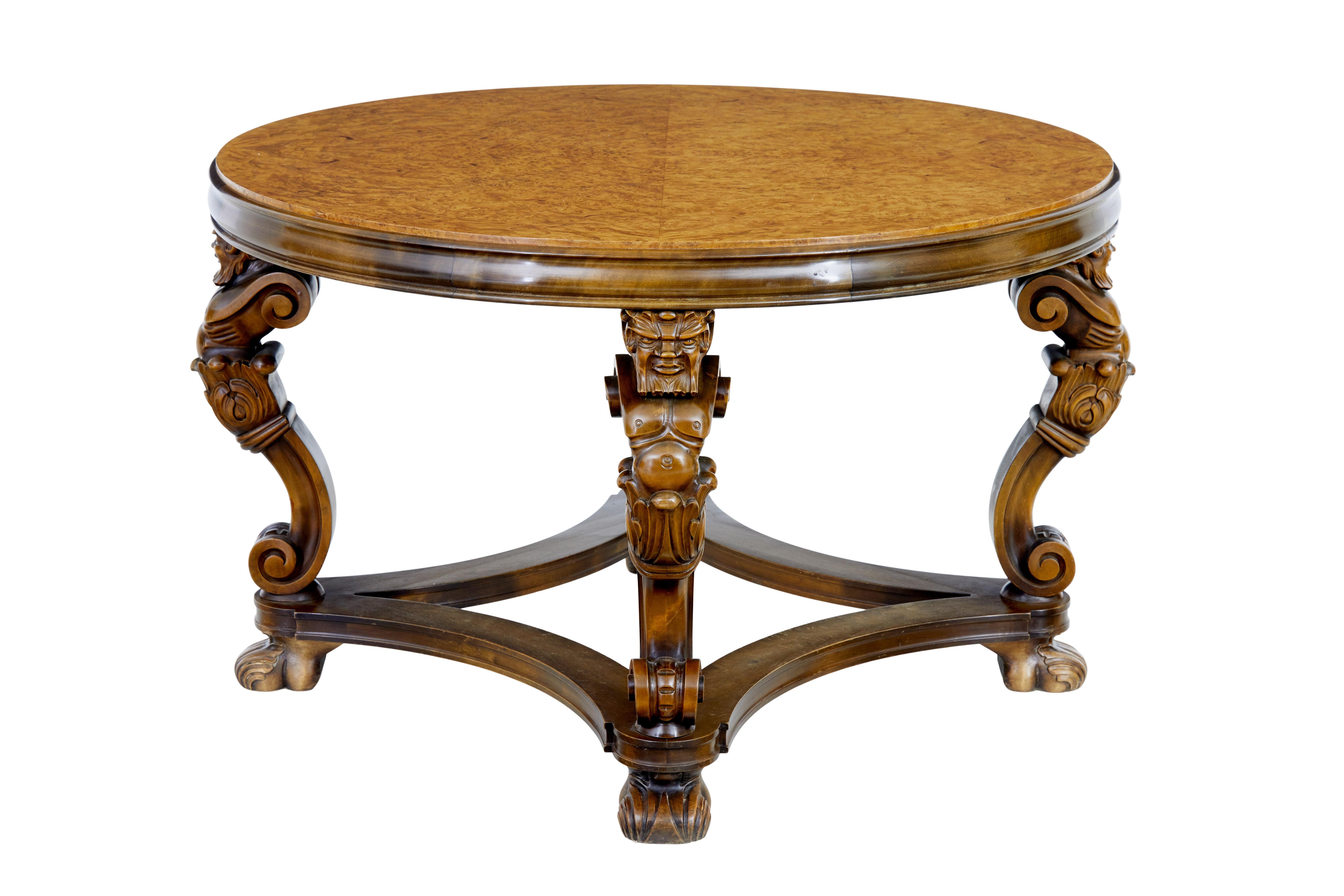 20th century carved burr birch coffee table circa 1950.

Fine quality Art Deco inspired coffee table.

Stunning Swedish burr birch circular top.   4 carved grotesques form the legs, united by shaped stretcher.

Good colour.

Minor surface marks,