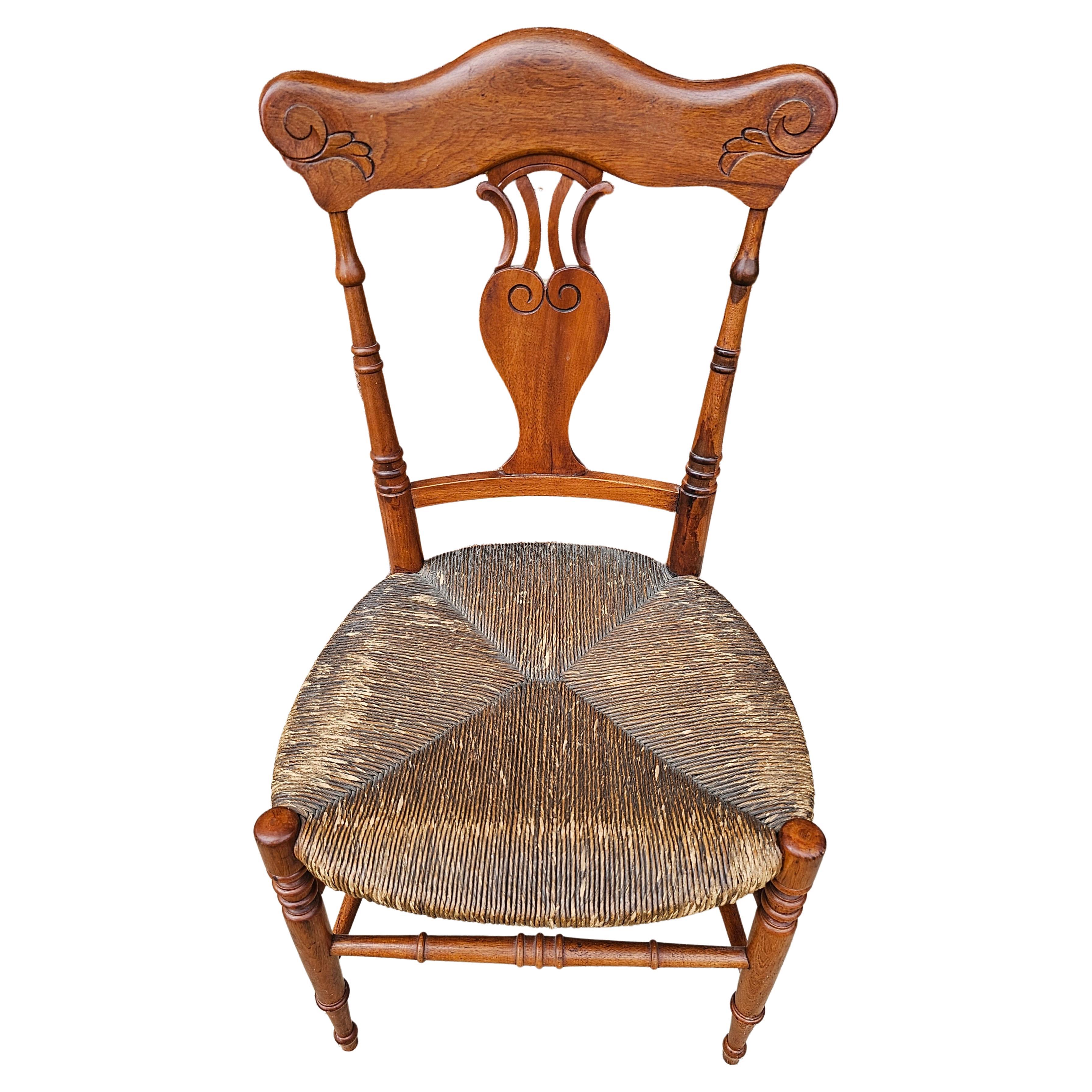 A very well crafted Mid-20th Century Carved Mahogany and Low Rush Seat Side Chair in very good vintage condition.
Great for smaller persons. Will make a great addition to your personal collection. Measures 16