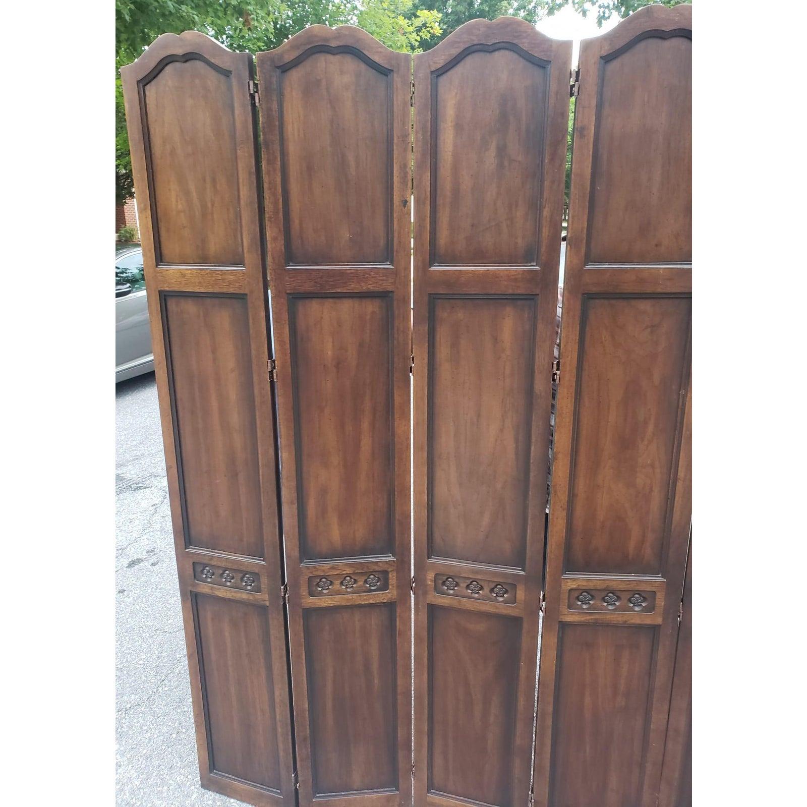 Carved solid walnut room divider in excellent condition. Comes in 5 panels with hinges. Each panel measures 60