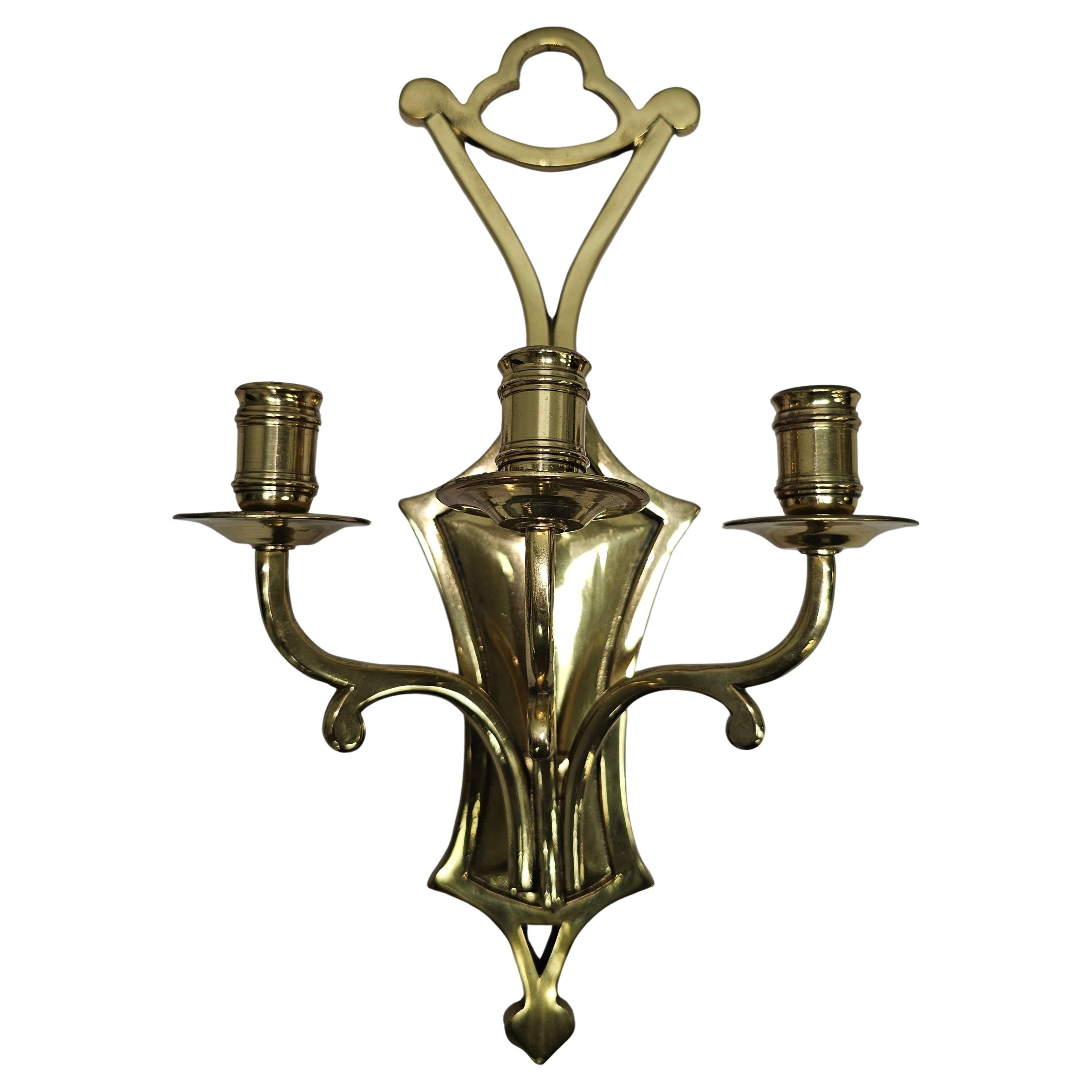 A Mid 20th Century Cast Brass Three Light Wall Candle Sconce
Measures 9