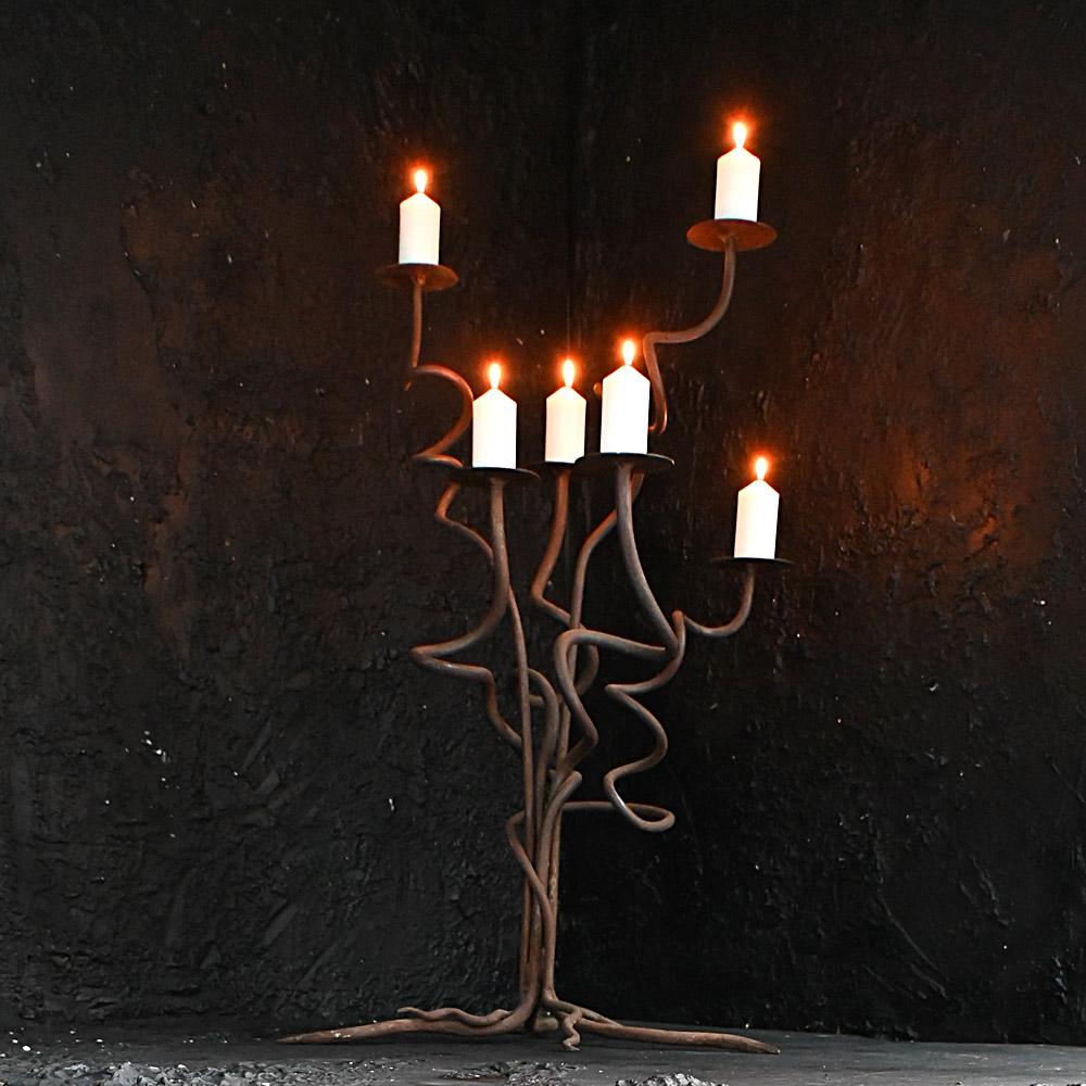 Mid-20th Century Cast Iron Organic Candle Floor Stand
An unusual cast iron floor standing mid-20th century organic formed candle still holder. Resembling a branch or tree form sculptural look. 
Size in inches approx. includes stand.: H 37” x W 25” x