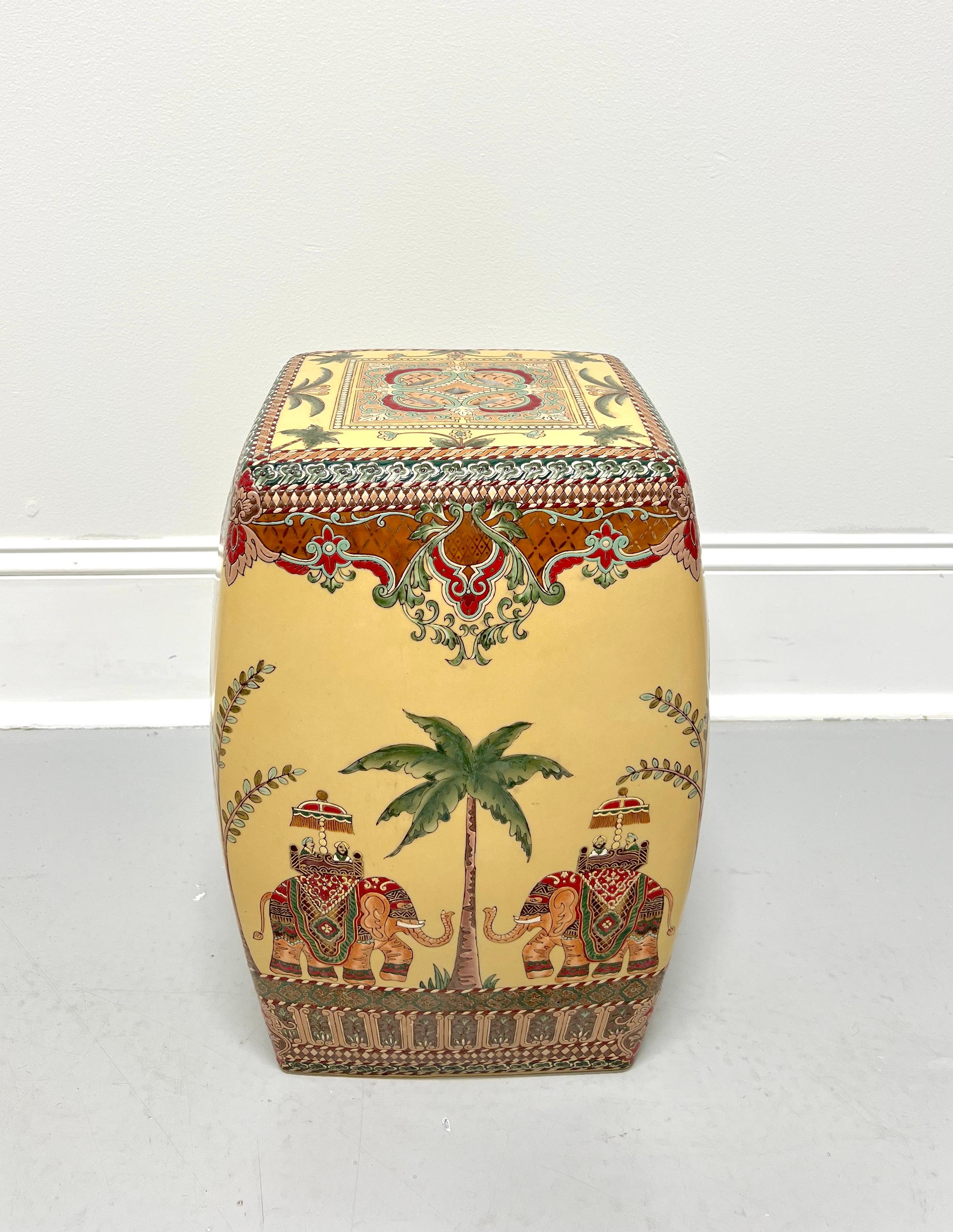 An Asian style ceramic garden stool, unbranded. Glazed ceramic in a square shape with decorative perforations, hand painted with a tropical motif of elephants, palm trees, and mosaic patterns. Likely made in Asia, in the mid 20th Century.