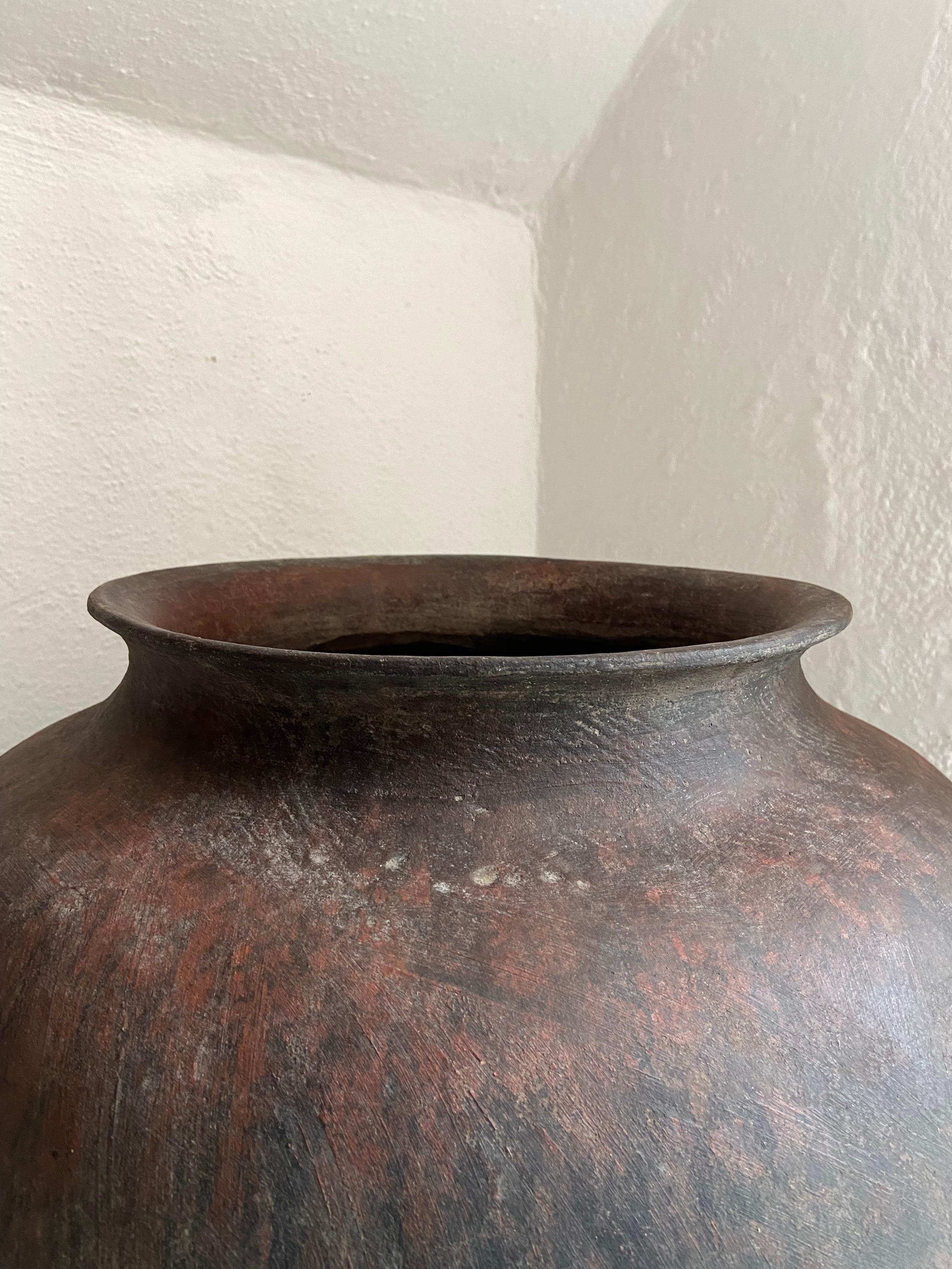 20th century Ceramic pot from the remote sierras of Michoacan. This pot was originally used to store water for household use.