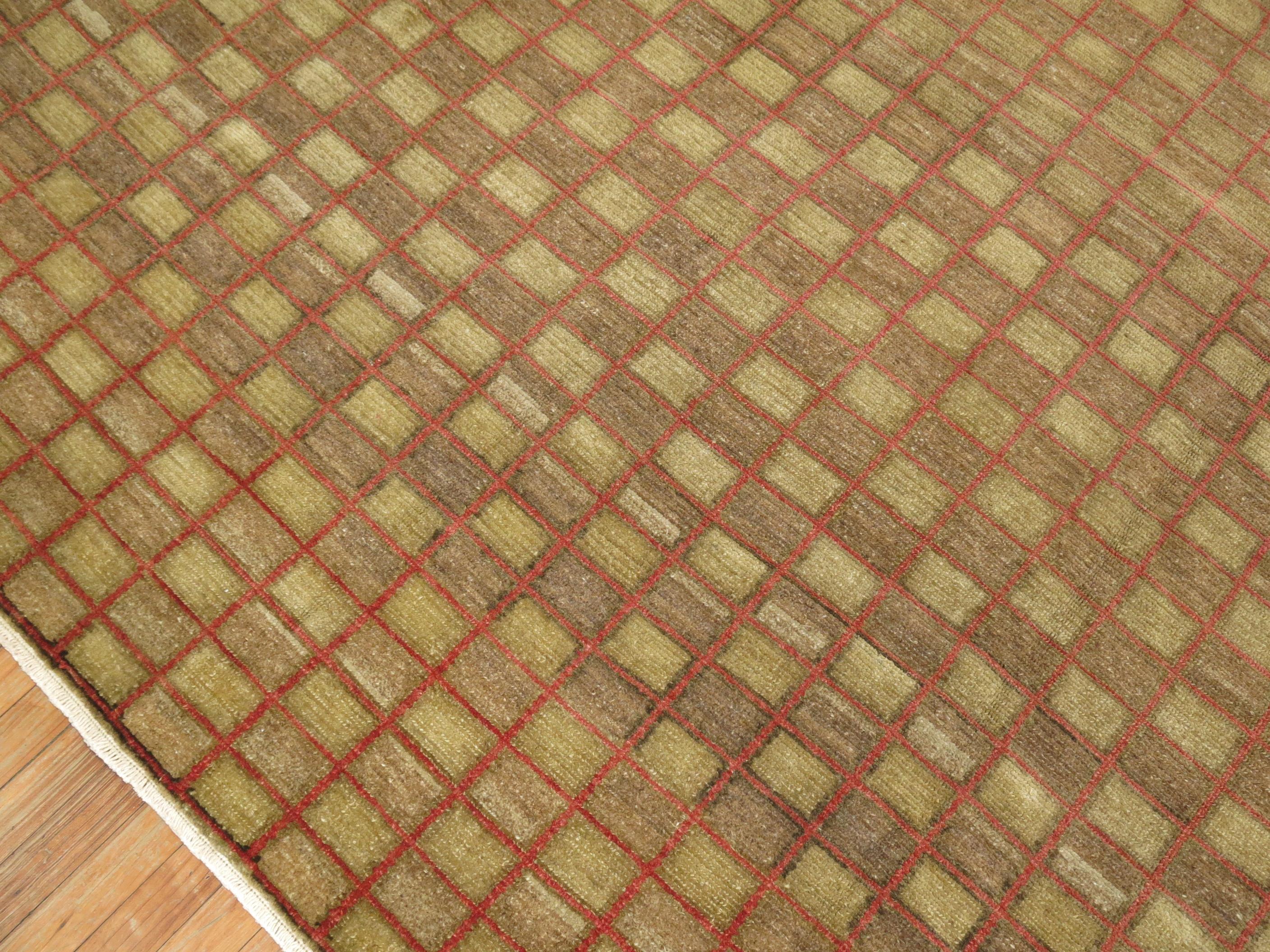 A Turkish Anatolian checkered room-size carpet handmade during the mid-20th century with an all-over checkerboard pattern racing over a brown color ground

Measures: 10' 10
