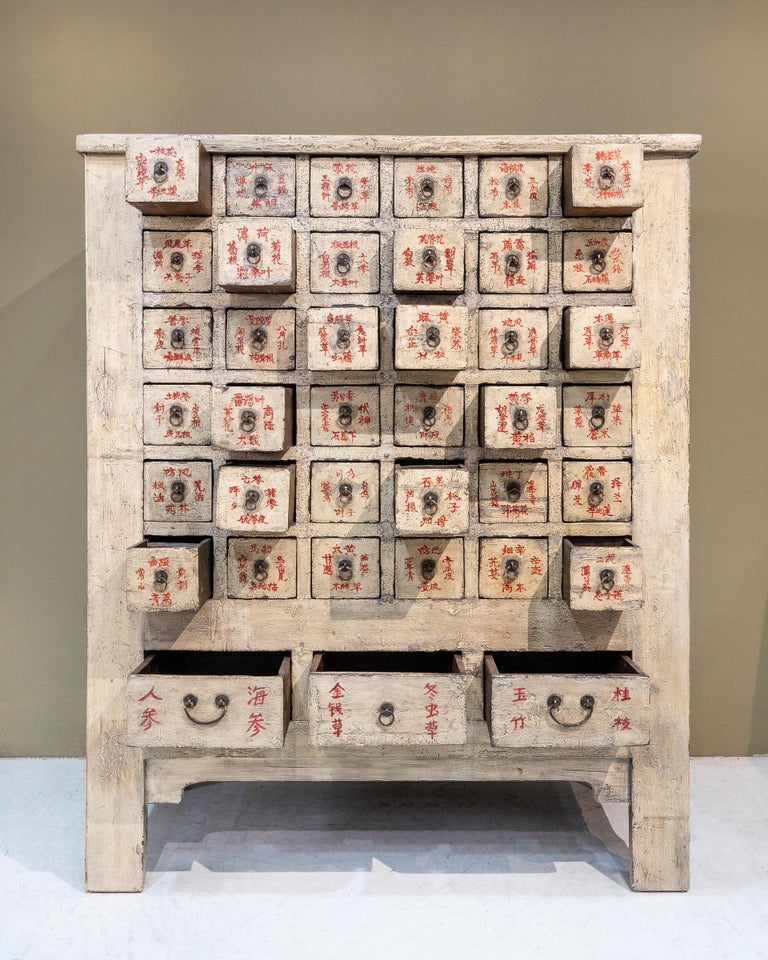 Mid 20th century Chinese apothecary cabinet from Shanxi, China. These were used to store and organise Chinese herbs and the drawers were labeled according to the herbs that were stored inside. Every small drawer measures roughly W14.3 x H12.5cm,
