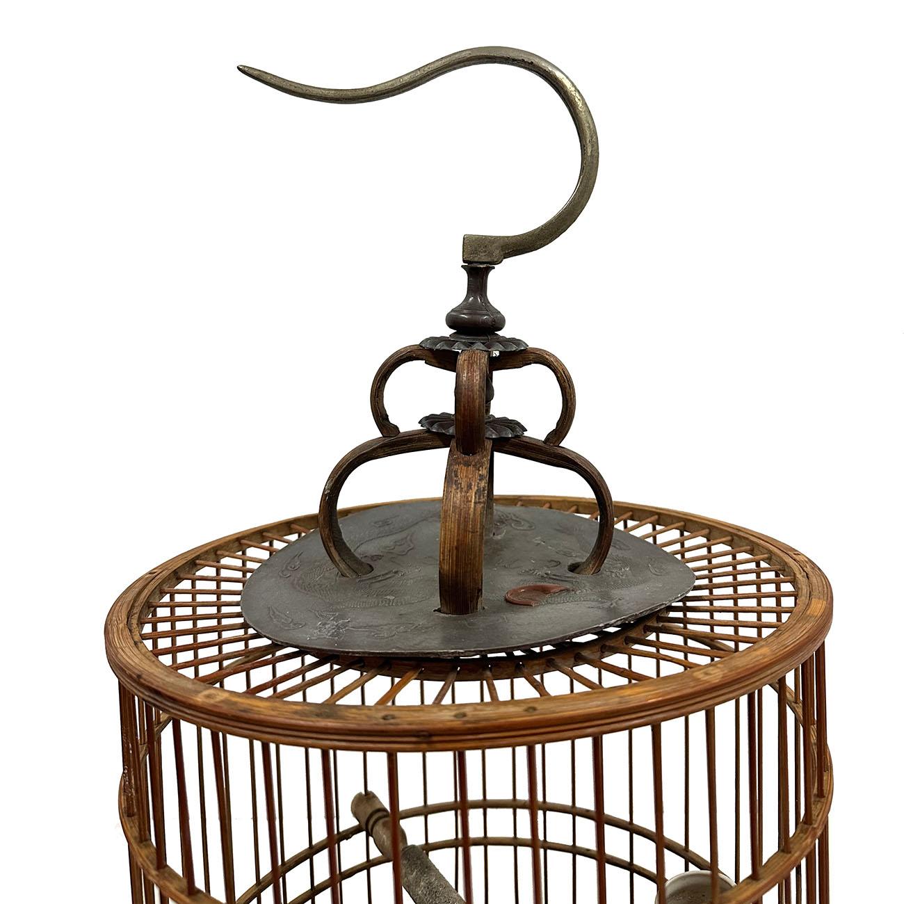 This beautiful bird cage is made from bamboo strip with wonderful carving works at bottom. The even distribution of each bar around the cage and the precise of each joining point show the beauty and elegant of the piece. All hand made and hand