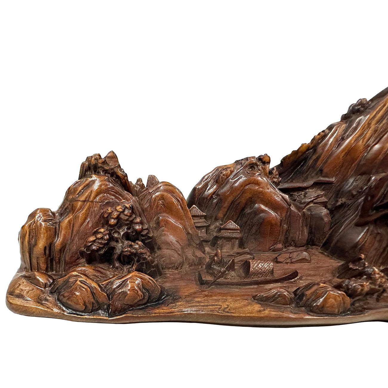 This sculpture has exquisite carved landscaping and buildings, etc. Detailed hand carving works on a piece of Boxwood. It was used as paper weigh - a scholar arts on the desk. Look at the detailed pictures, very beautiful ornaments art that you can