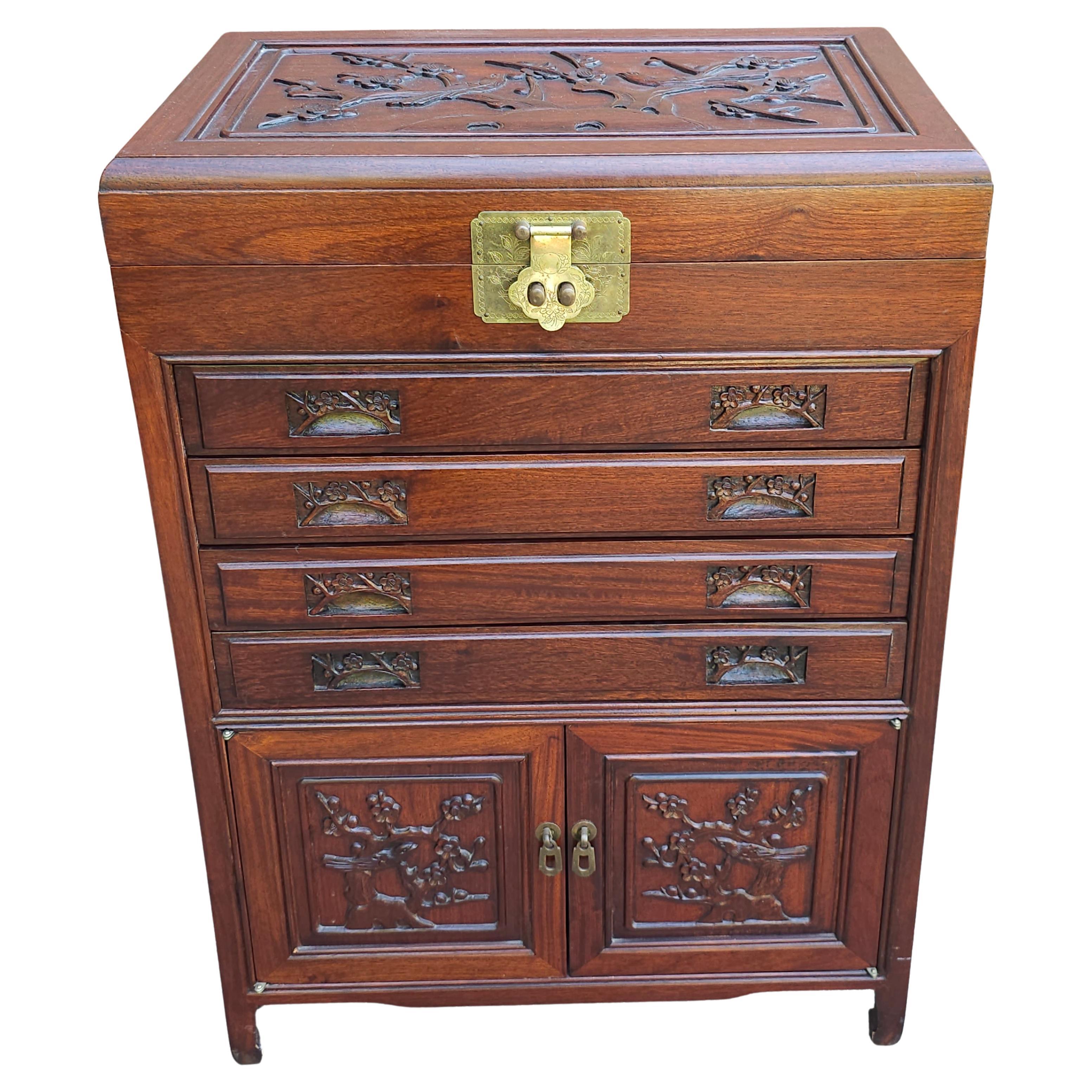 An exceptional Mid-20th Century Chinese Carved Rosewood Siver Chest and Cabinet in great vintage condition.
Features a flip top that open to reveal two flatware storage trays all felt lined. The Four drawers open open and close flawlessly and are