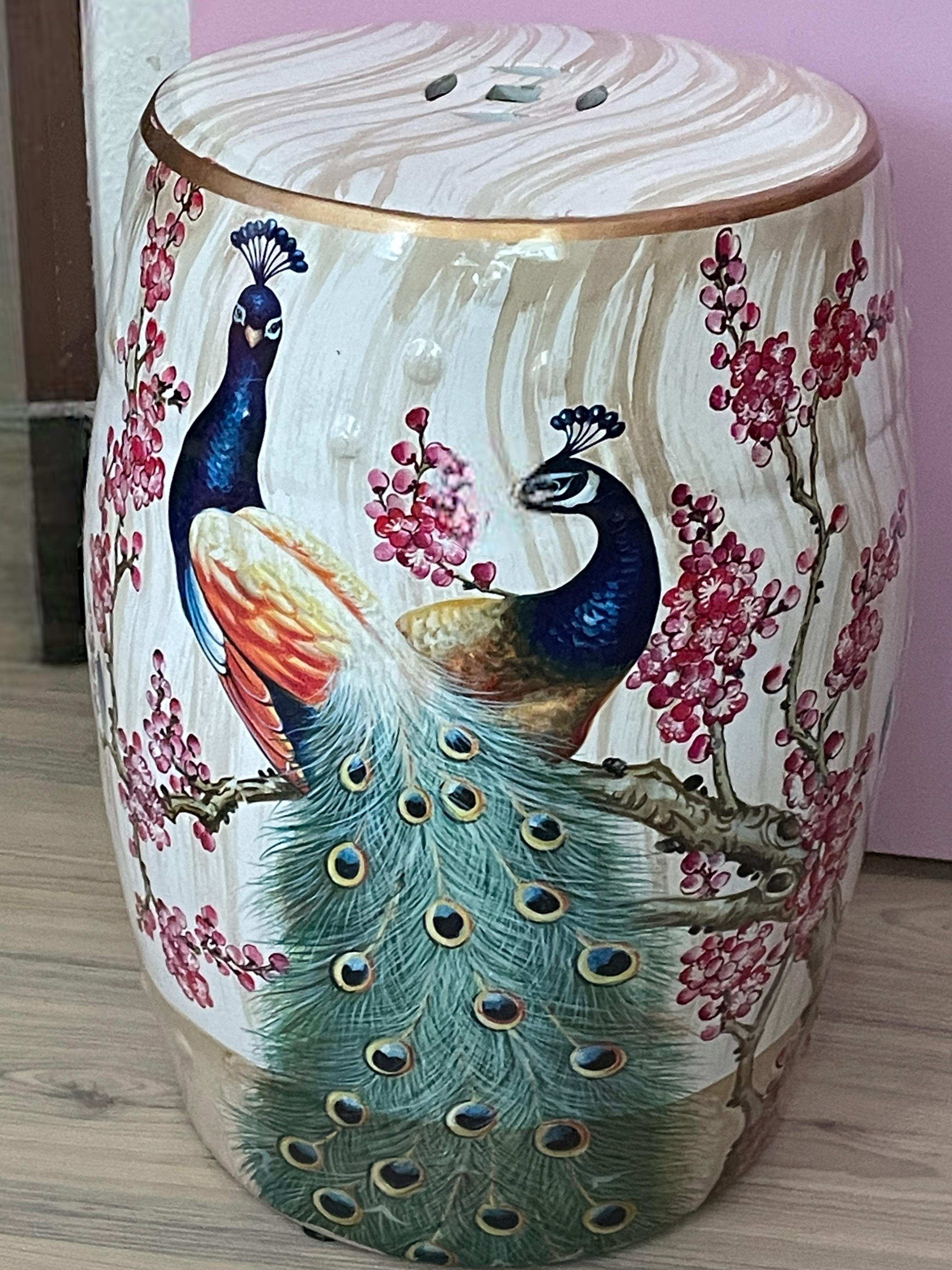 Mid-20th century Chinese export hand painted porcelain yellow and faux bamboo style garden stool or flower pot seat. This lovely piece has a flower and peacock motif on two sides. Features raised dot detail and Chinese geometric cut-out symbols on