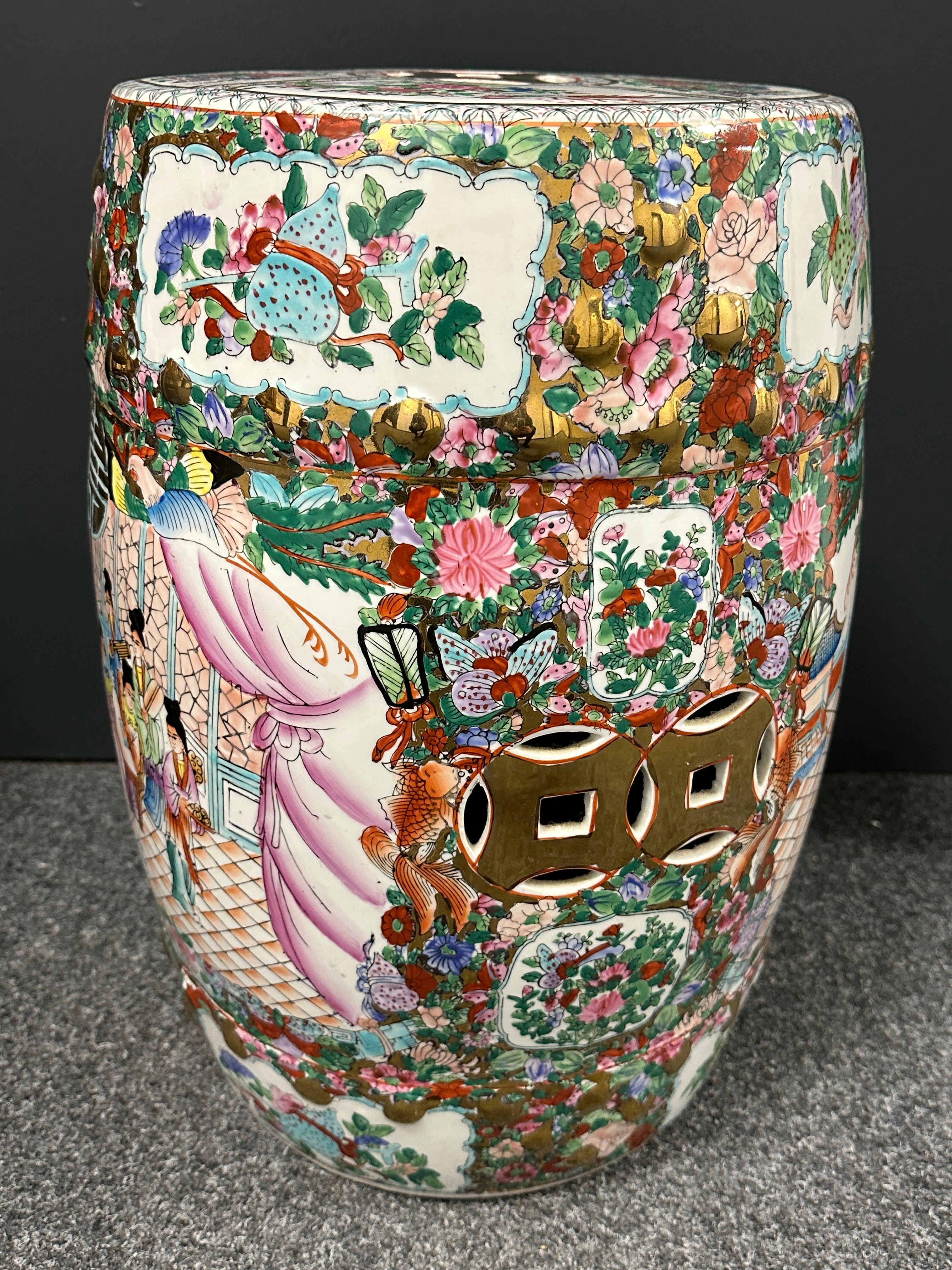 Mid-20th century Chinese export hand painted porcelain multicolored garden stool or flower pot seat. This lovely piece has a Chinese or Japanese landscape motif. Features raised dot detail and Chinese geometric cut-out symbols on the sides and