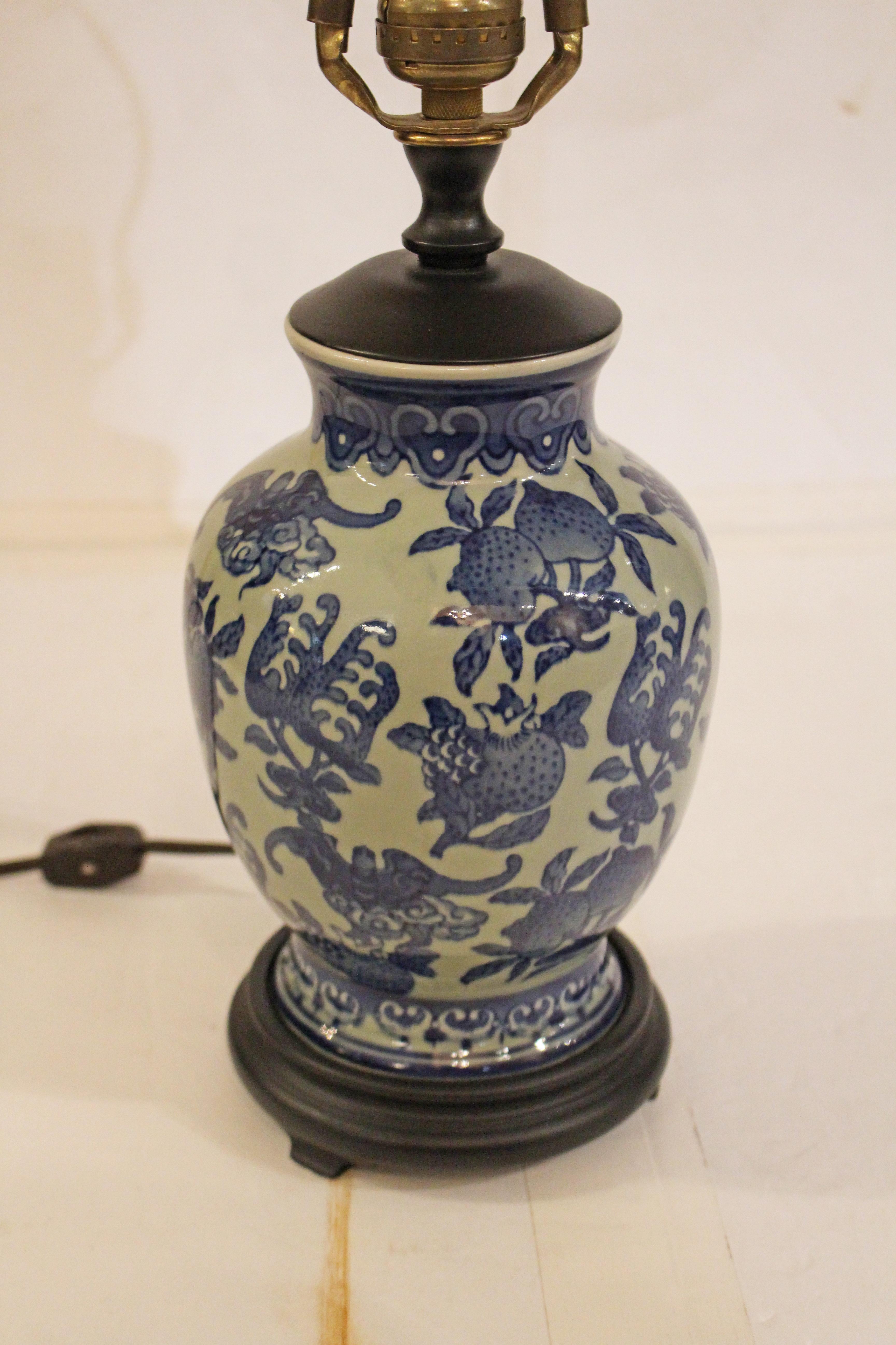 Mid-20th century Chinese export porcelain vase mounted as a lamp. Blue & celadon decorated with pomegranates & bats; lappet borders. 7.25