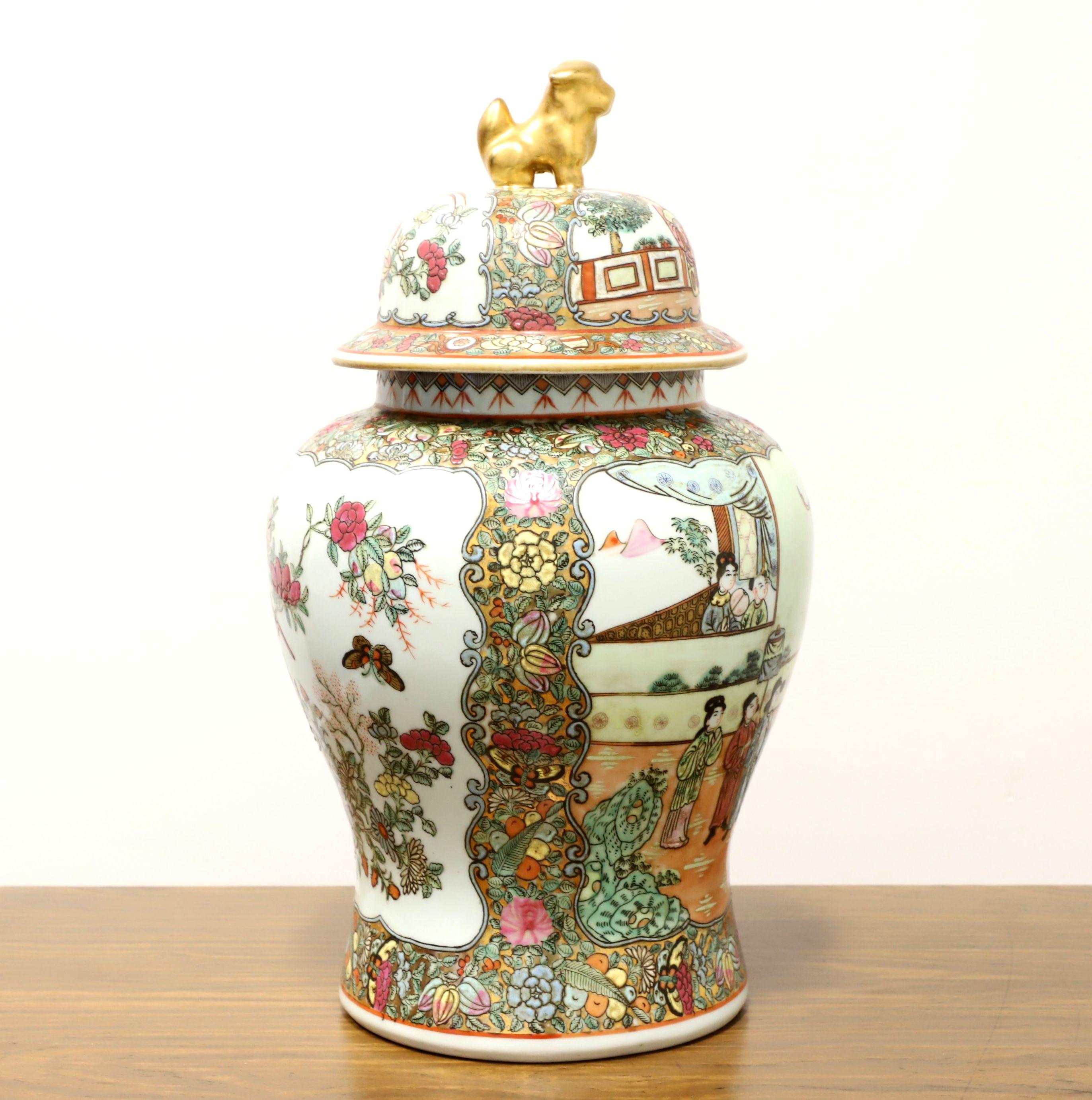 An Asian chinoiserie style ginger jar with lid, unbranded. fine porcelain body, hand painted with a multi-color chinoiserie scene and a tiny gold painted dog to form the handle for lid. Made in China, in the mid 20th century.

Measures: 11w 11d
