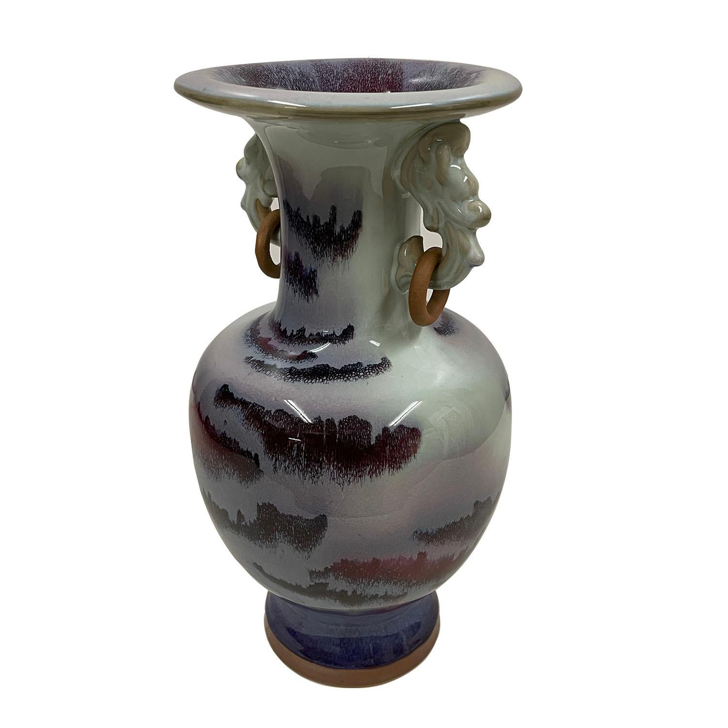 Look at this magnificent Chinese Jun porcelain vase. It was hand made and hand paint from famous Chinese Jun Porcelain. It shows the natural fambe glaze landscaping pattern that came out from high heat making process. very nice overlay ox-blood red,