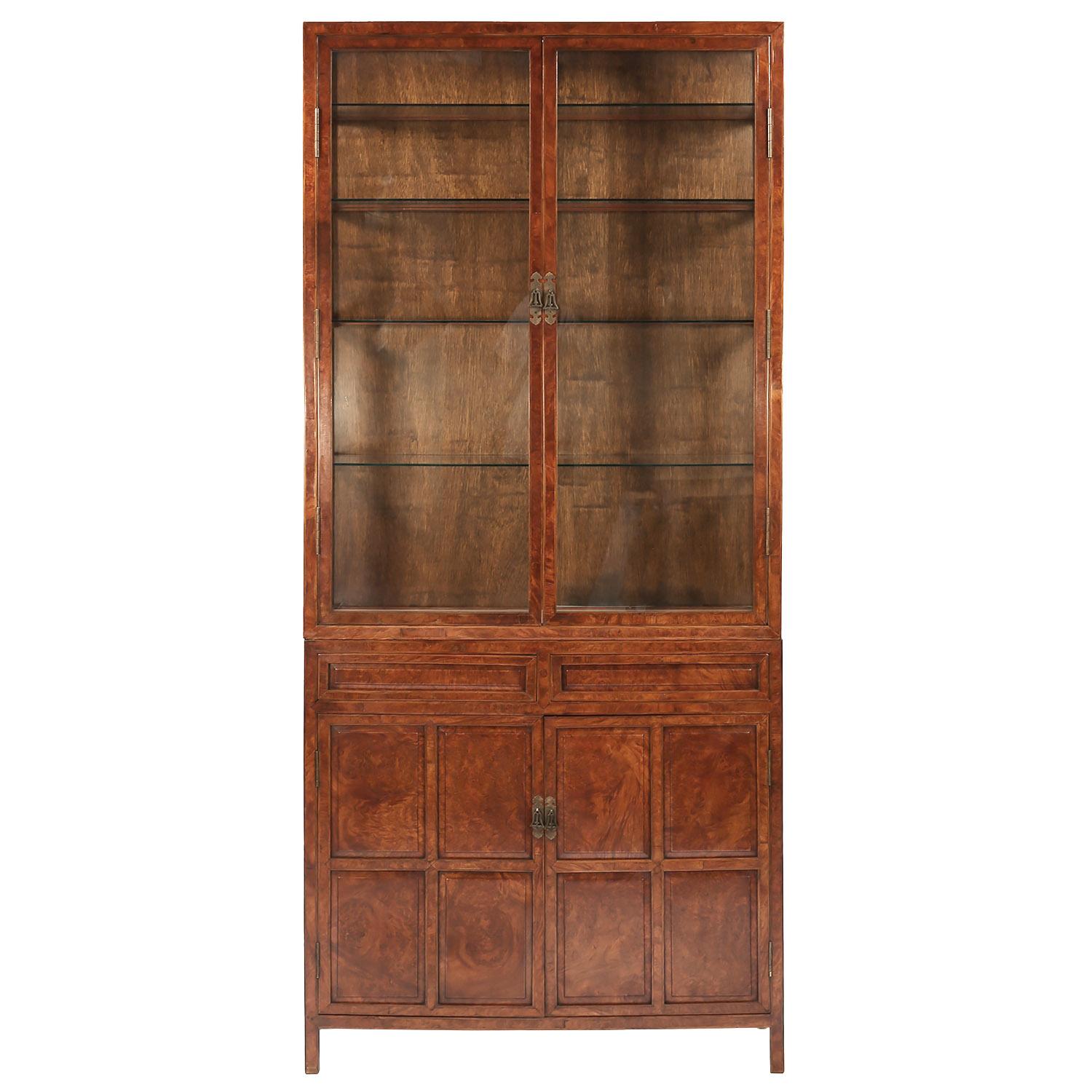 Mid-20th century Chinese lighted burl wood and glass tall two-piece cabinet

The top cabinet has two glass doors, glass sides and four glass shelves. The lower cabinet has two burl wood fronted drawers above two burl wood fronted doors behind