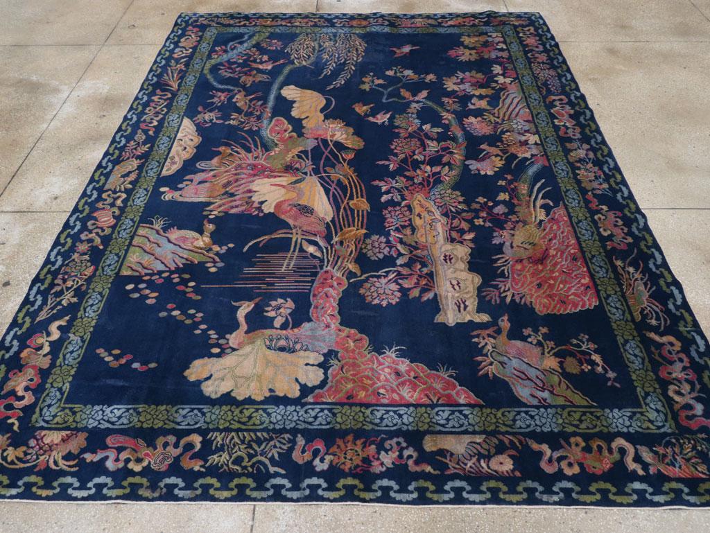 A Chinese Pictorial Peking Inspired English Axminster Room Size Carpet handmade during the Mid-20th century.

Measures: 8' 11