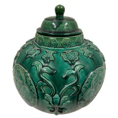 Mid-20th Century Chinese Raised Carved Glazed Ceramic Jar with lid.