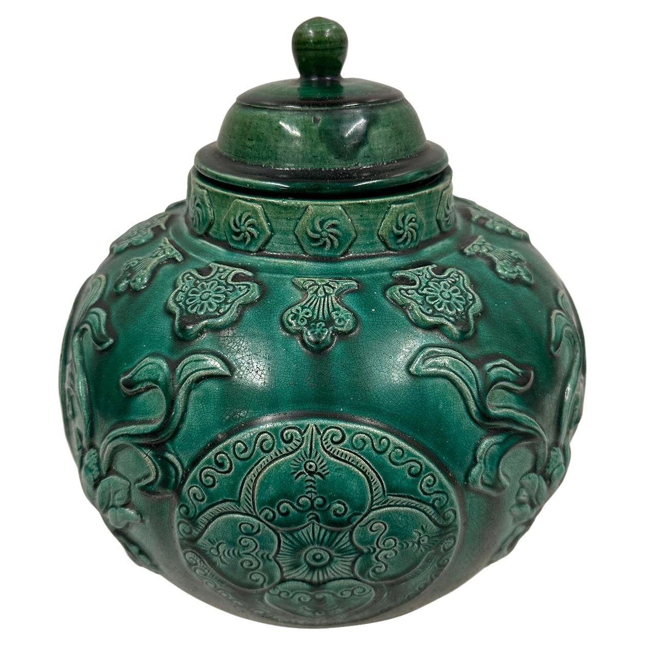 Mid-20th Century Chinese Raised Carved Glazed Ceramic Jar with lid. For Sale