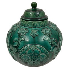 Mid-20th Century Chinese Raised Carved Glazed Ceramic Jar with lid.