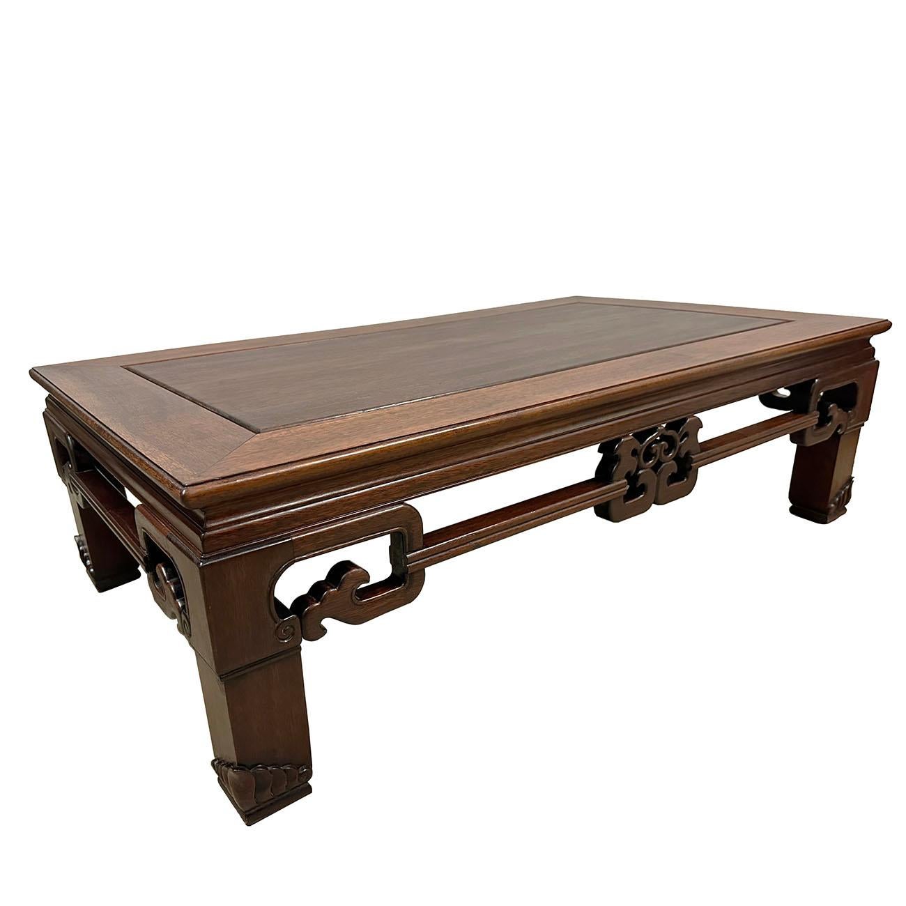 This classic solid rosewood coffee table has hand-carved imperial dragon cloud motif along the four sides. The Huge carved legs ending on the big cube feet give a graceful and also sturdy look. Constructed with traditional joinery technique provides
