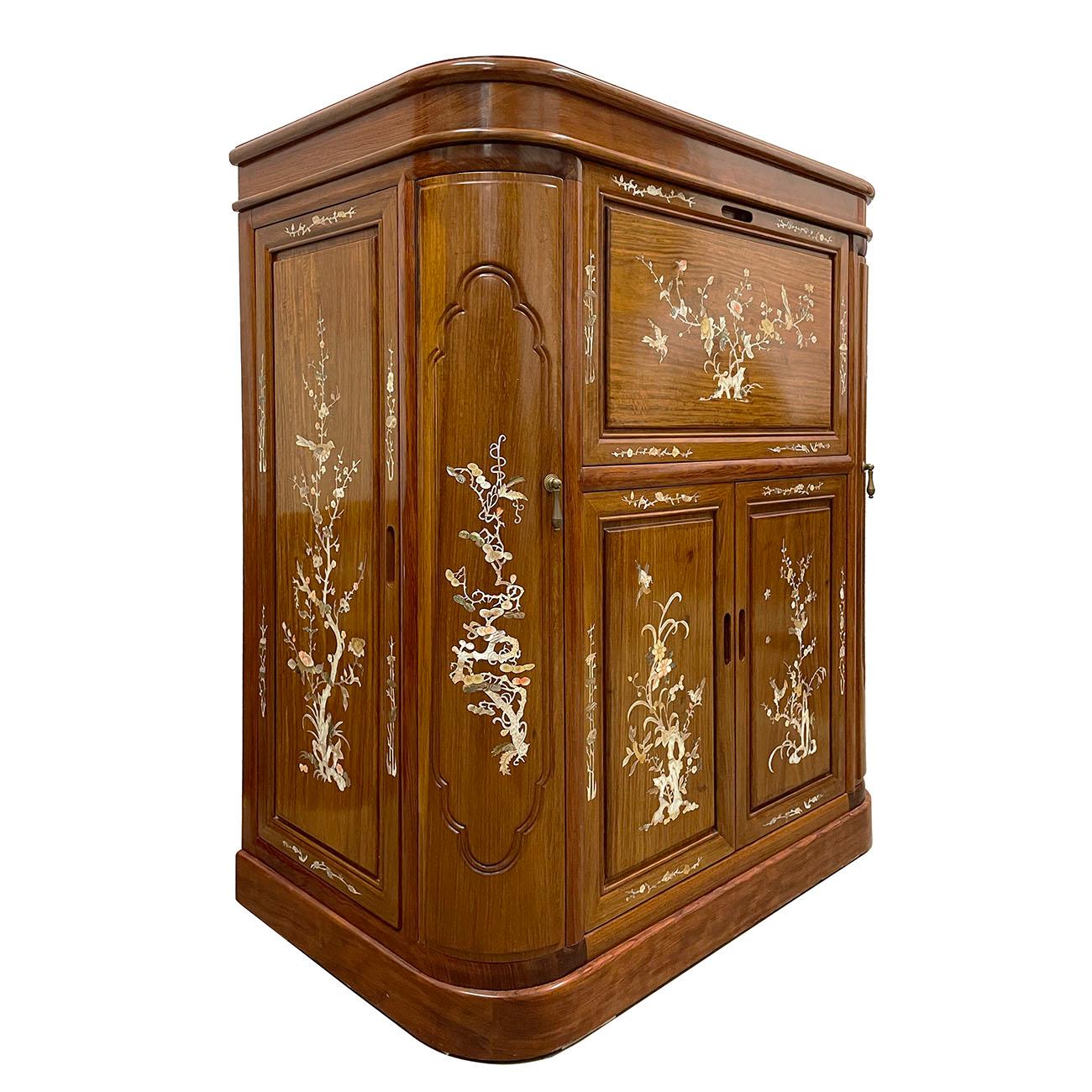 This beautiful carved wine cabinet has lot of detailed Mother of Pearl inlay works on the front and side. This cabinet features top opening and drop down opening on the front with Chinese traditional carving panel behind shelf. Two opening doors