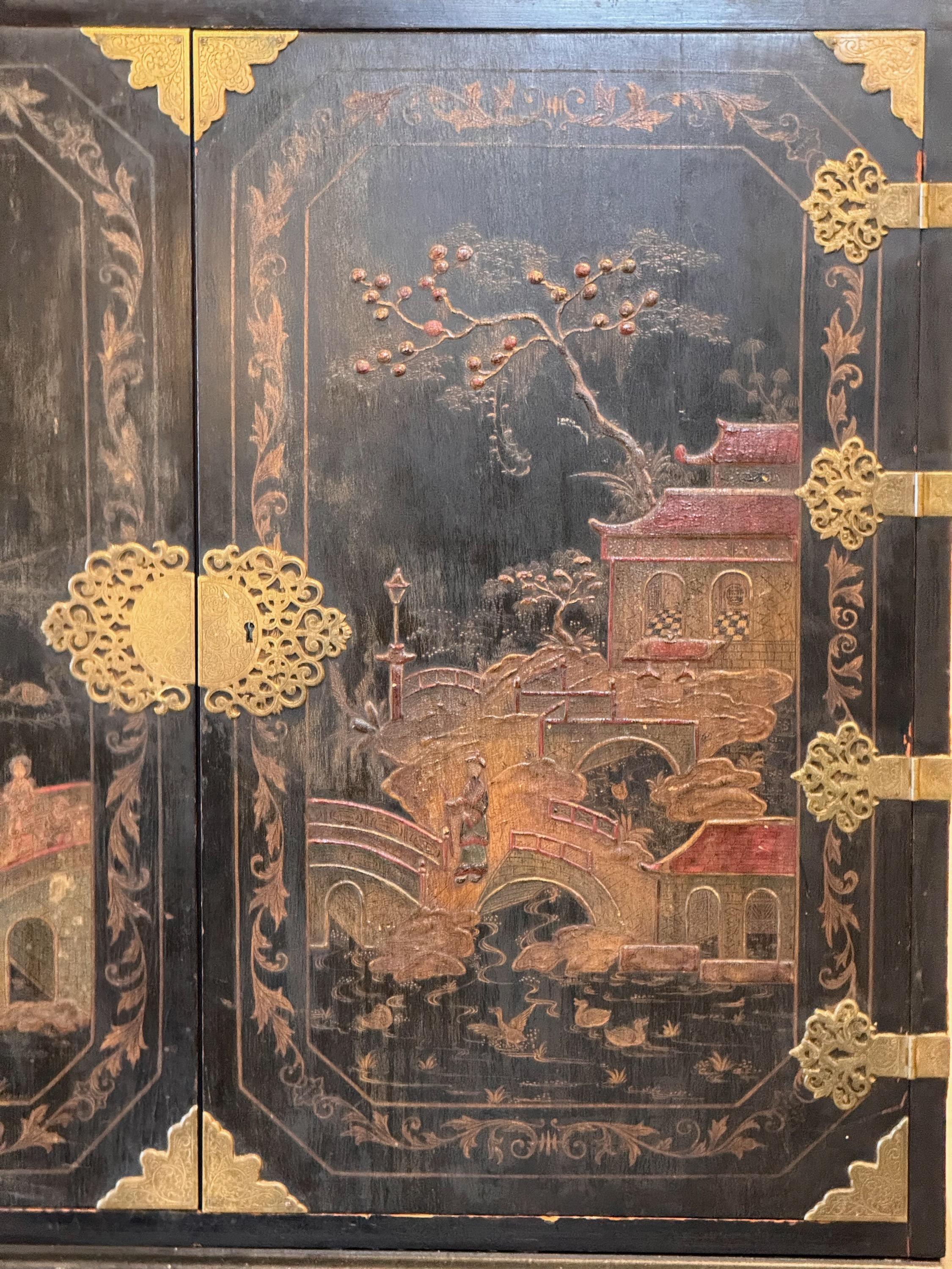 A Chinoiserie decorated cabinet on stand . A stylish piece