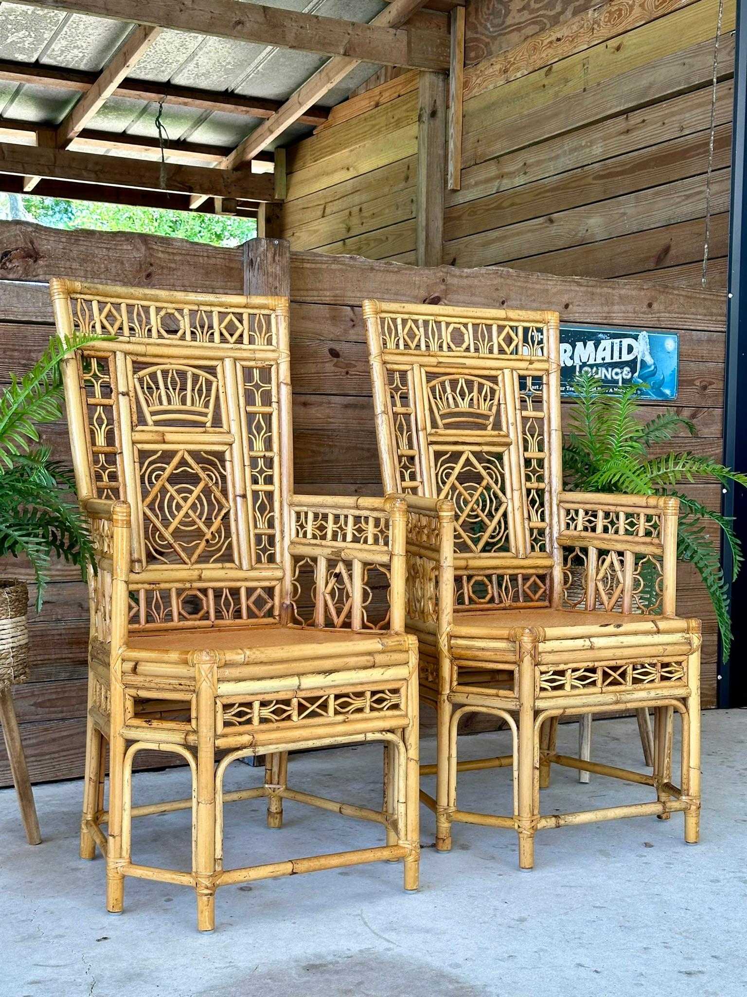 Exquisite pair of vintage rattan side armchairs with incredible fretwork details, rattan weave solid seats and leather wrap bindings for a chinoiserie coastal style.
Amazing chairs for captains chairs at a dining table or as side chairs either way