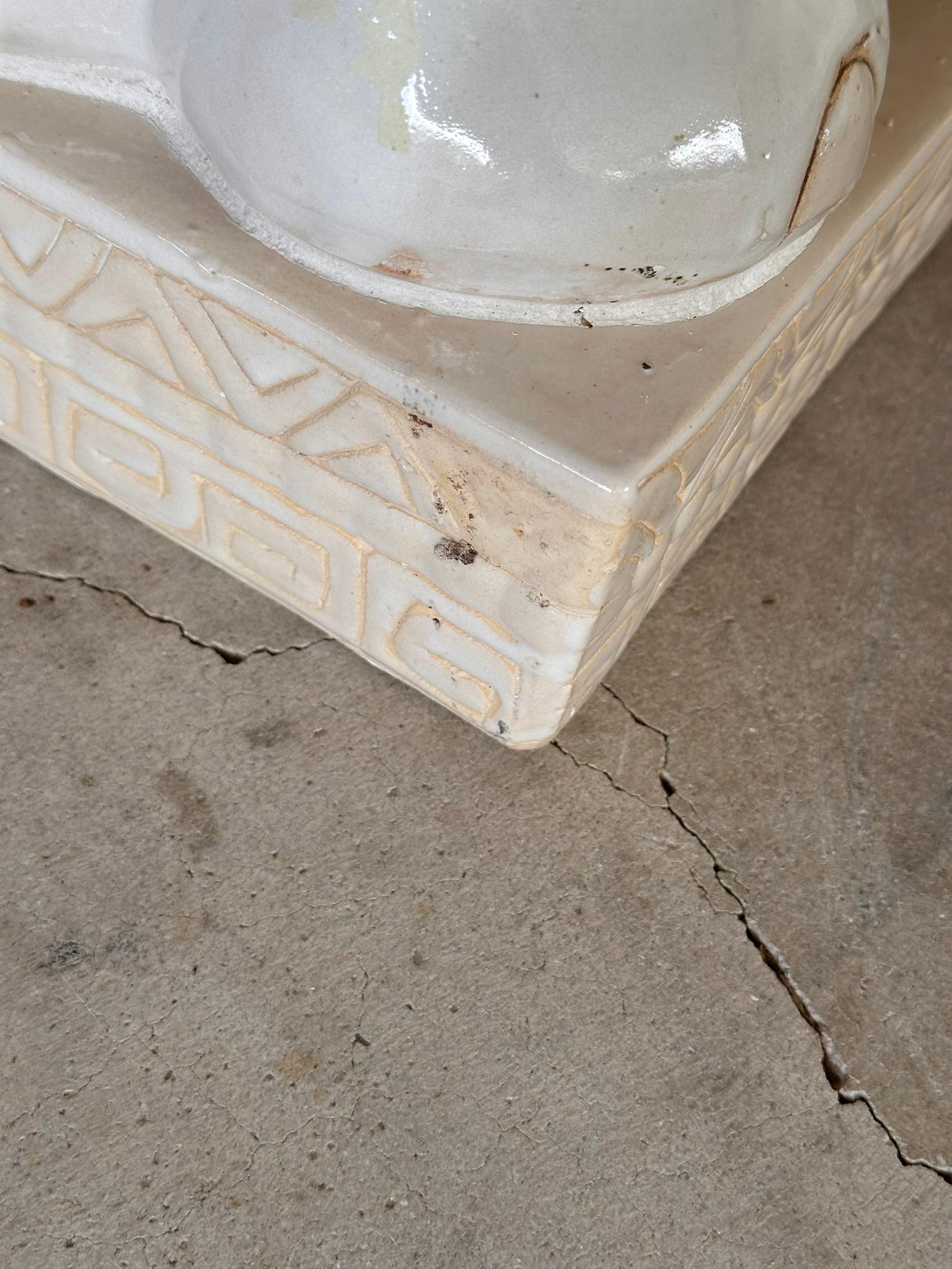 This charming pair of vintage ceramic elephant garden seats or side tables features a beautifully glazed finish and intricate detailing.
Each elephant is depicted with its trunk up, symbolizing good luck and fortune. The elephants stand on sturdy
