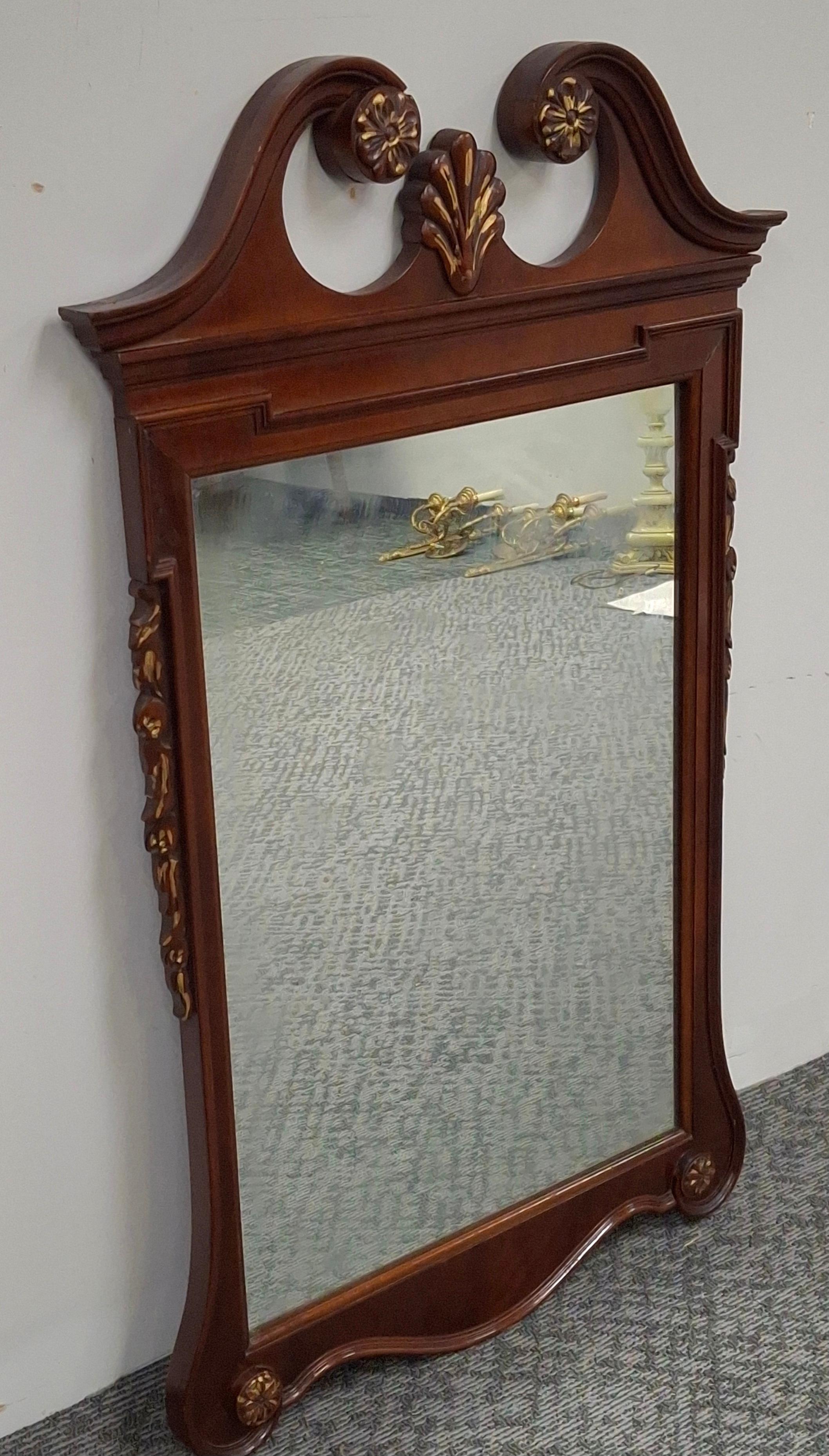 Stained Mid-20th Century Chippendale Style Mahogany Parcel Gilt Scroll Ear Wall Mirro For Sale