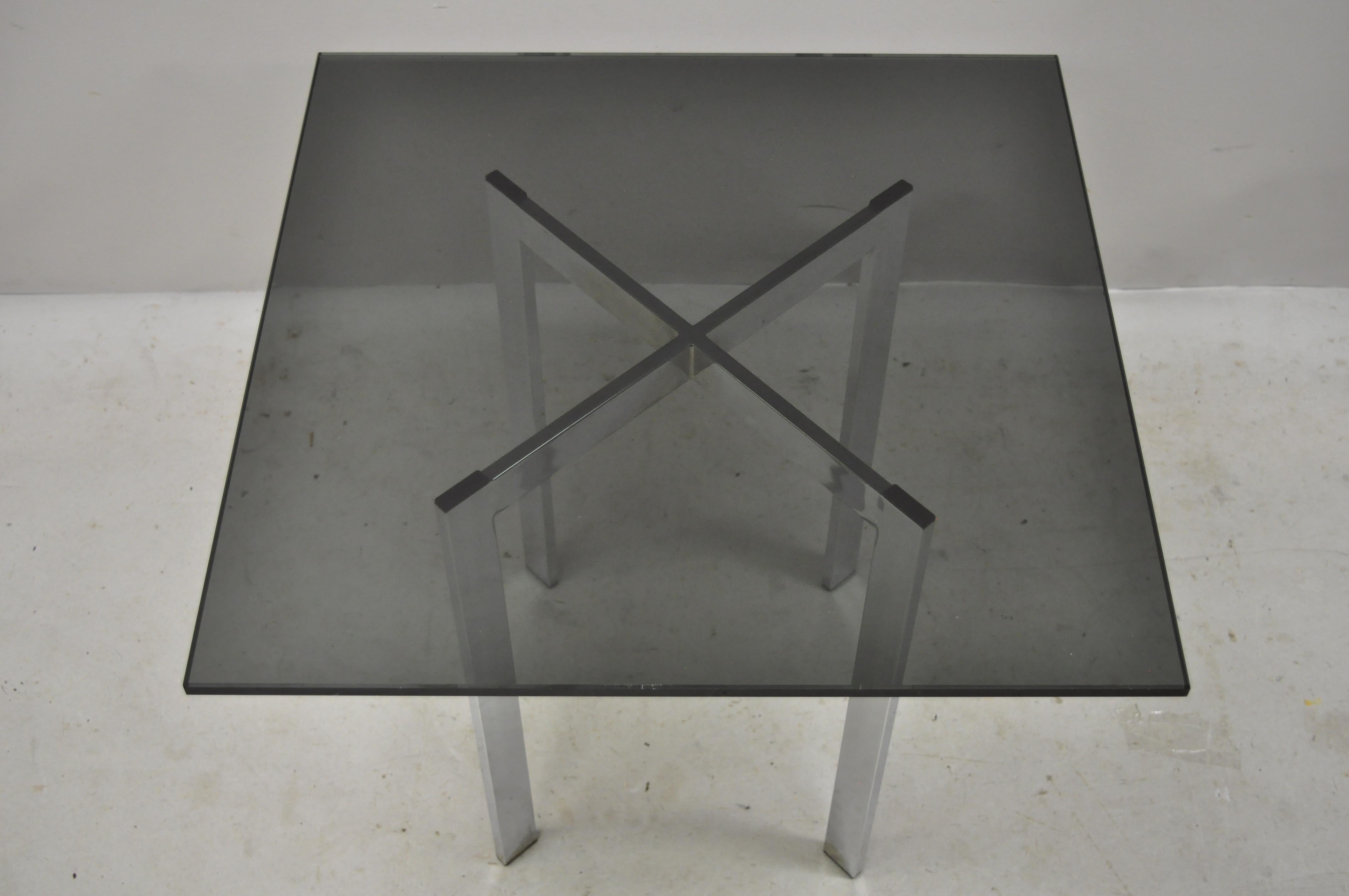 Mid-20th century chrome X-frame smoked glass Barcelona style side end table. Item features a smoked glass top, chrome X-frame, clean modernist lines, great style and form. Can be used with base up or down, circa mid-late 20th century. Measurements: