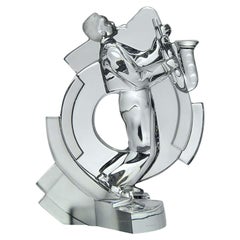 Mitte des 20. Jahrhunderts Klarglas-Skulptur "Jazz-Musiker mit Saxophon" von Sèvres