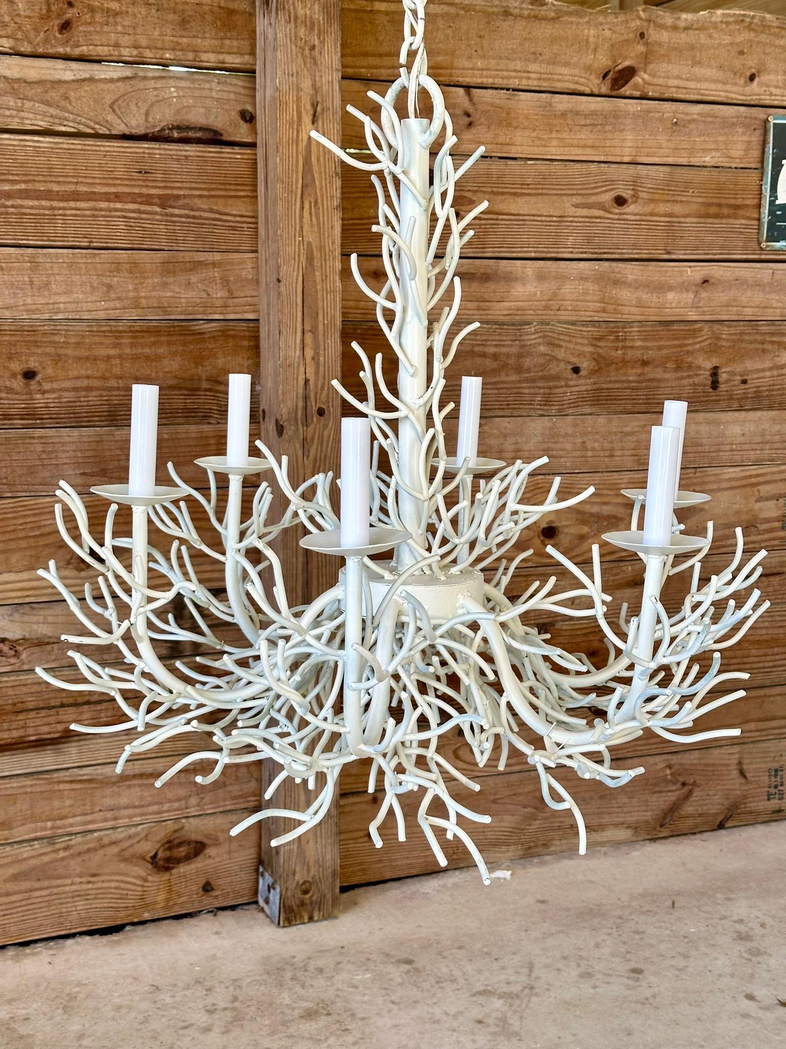 Presenting a stunning sculptural chandelier that embodies oceanic coastal elegance with six lights and the original 5-inch chain. Crafted from high-quality metal with a striking white rustic finish, its intricately designed branches mimic natural