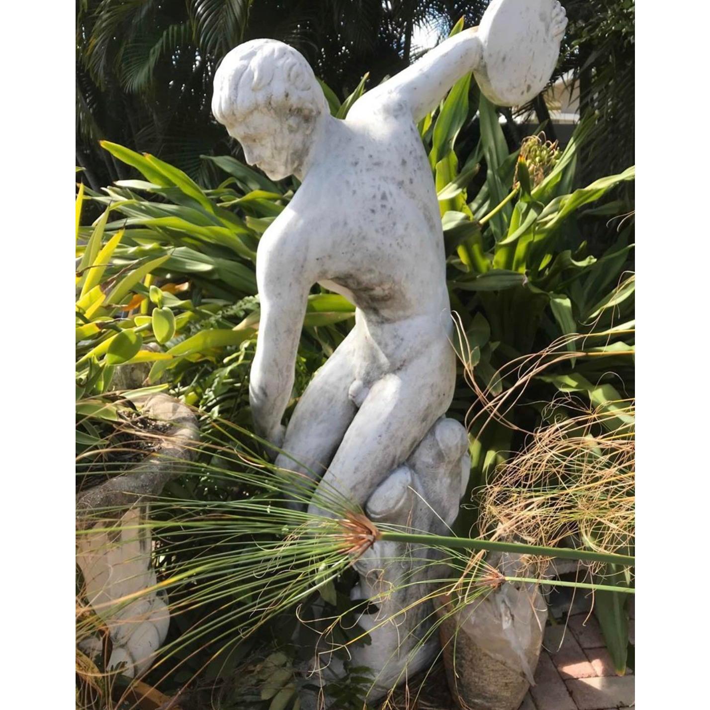 Brilliant life size Greek discus thrower. Super impressive in person. Made of concrete and has a vintage patina. Acquired from a Palm Beach estate.