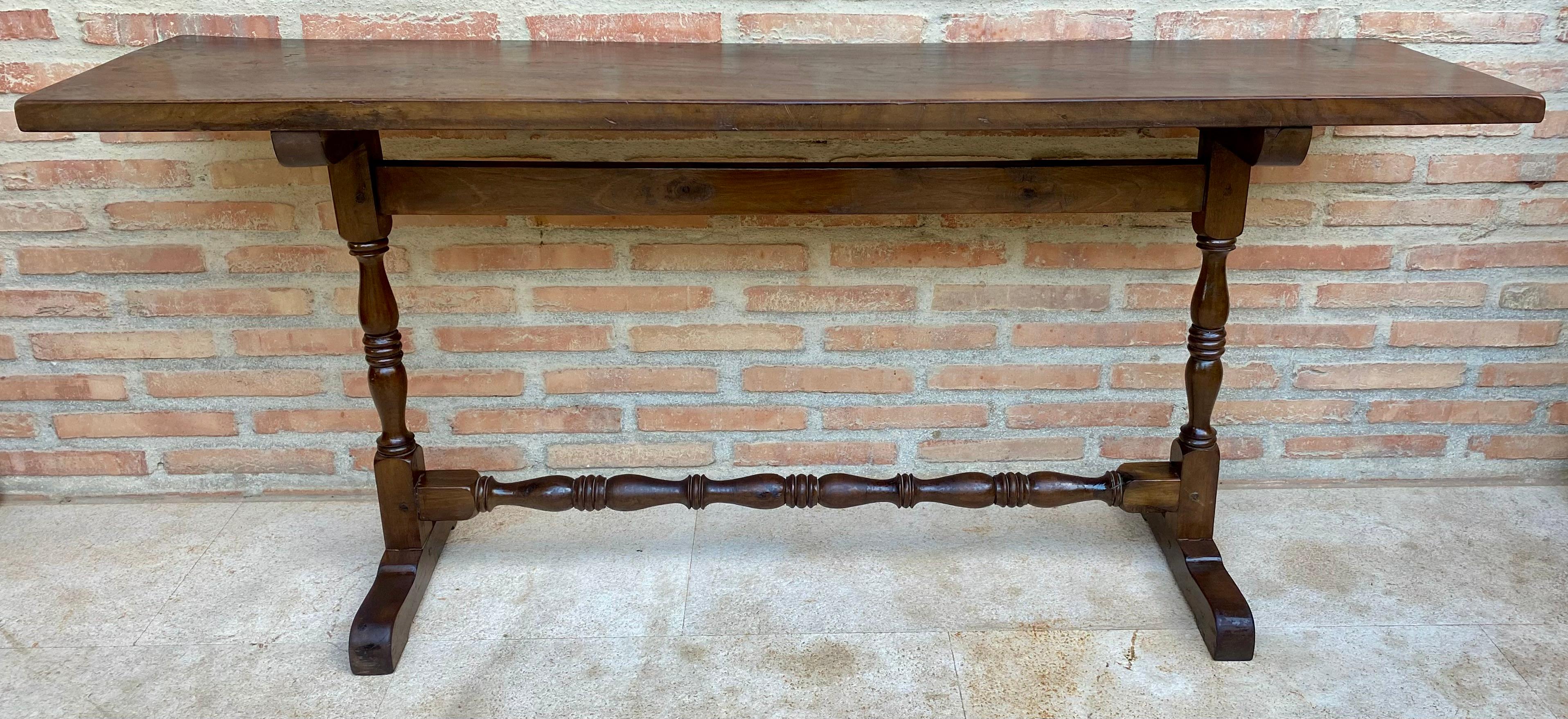 Rare Mid-Century Spanish-style console table, it has the typical turned bars of this period. Shown in original condition, includes refinishing.
